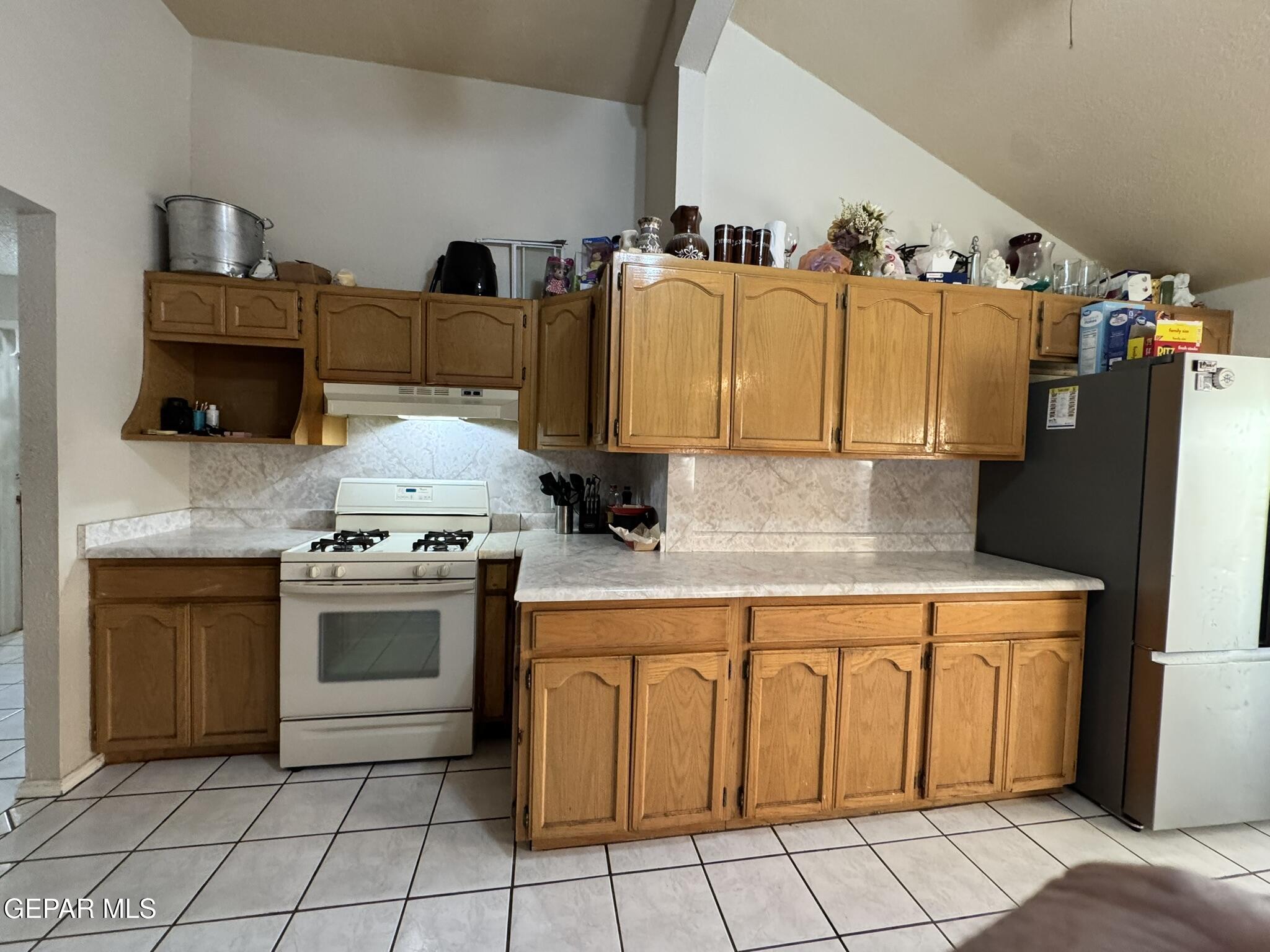 1623 Brian Ray Circle El Paso, TX 79936 - Photo 13 of 37 a kitchen with stainless steel appliances granite countertop a sink and cabinets