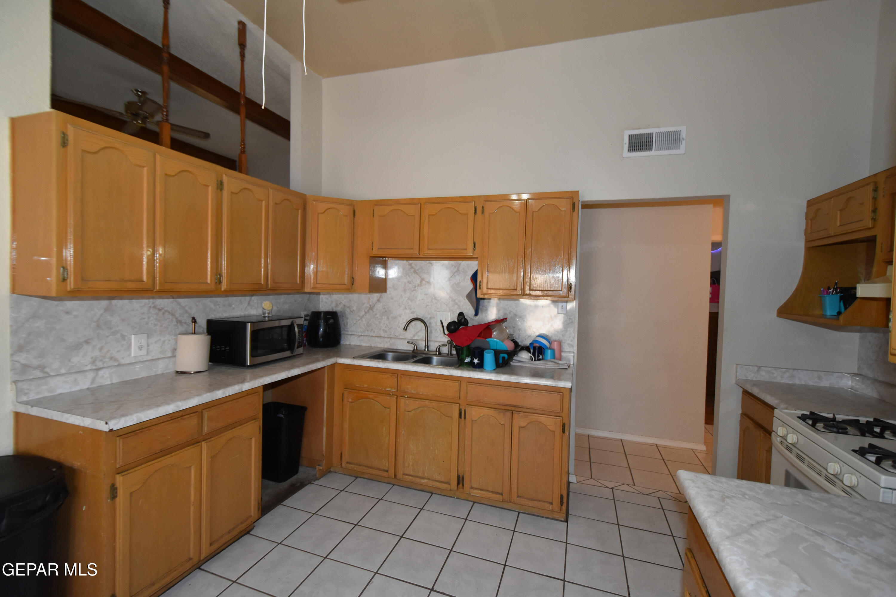 1623 Brian Ray Circle El Paso, TX 79936 - Photo 14 of 41 a kitchen with a sink appliances and cabinets