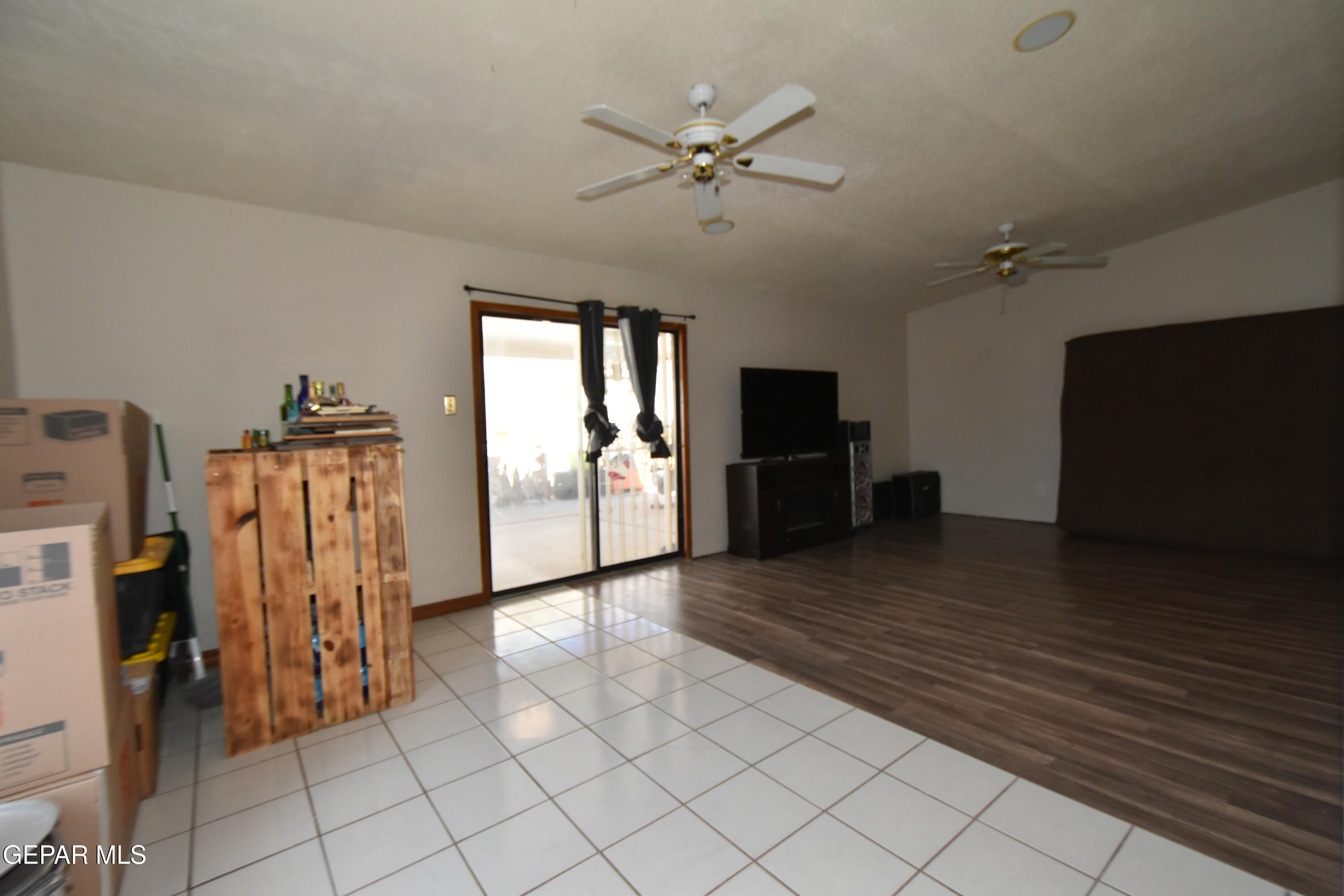 1623 Brian Ray Circle El Paso, TX 79936 - Photo 15 of 41 a view of a livingroom with furniture wooden floor and a ceiling fan