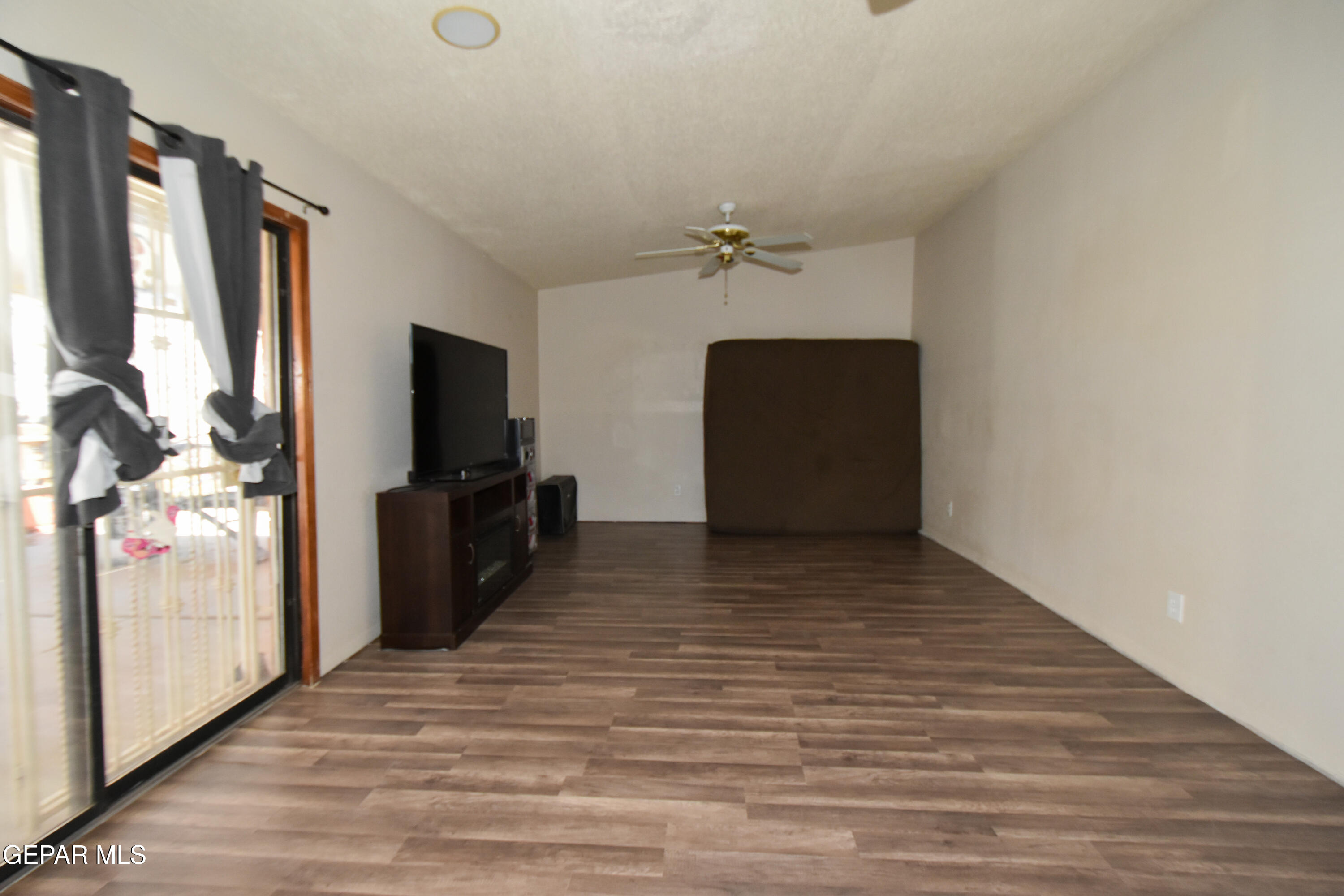 1623 Brian Ray Circle El Paso, TX 79936 - Photo 16 of 41 a view of a living room with a flat screen tv