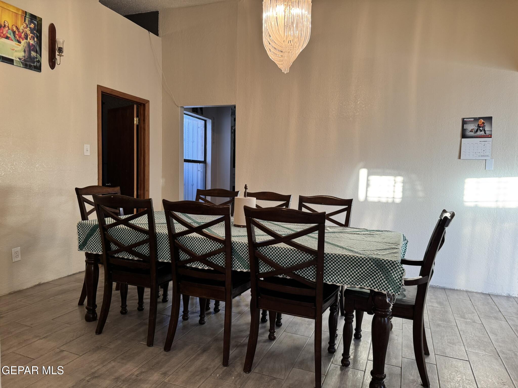 1623 Brian Ray Circle El Paso, TX 79936 - Photo 18 of 37 a view of a dining room with furniture and chandelier