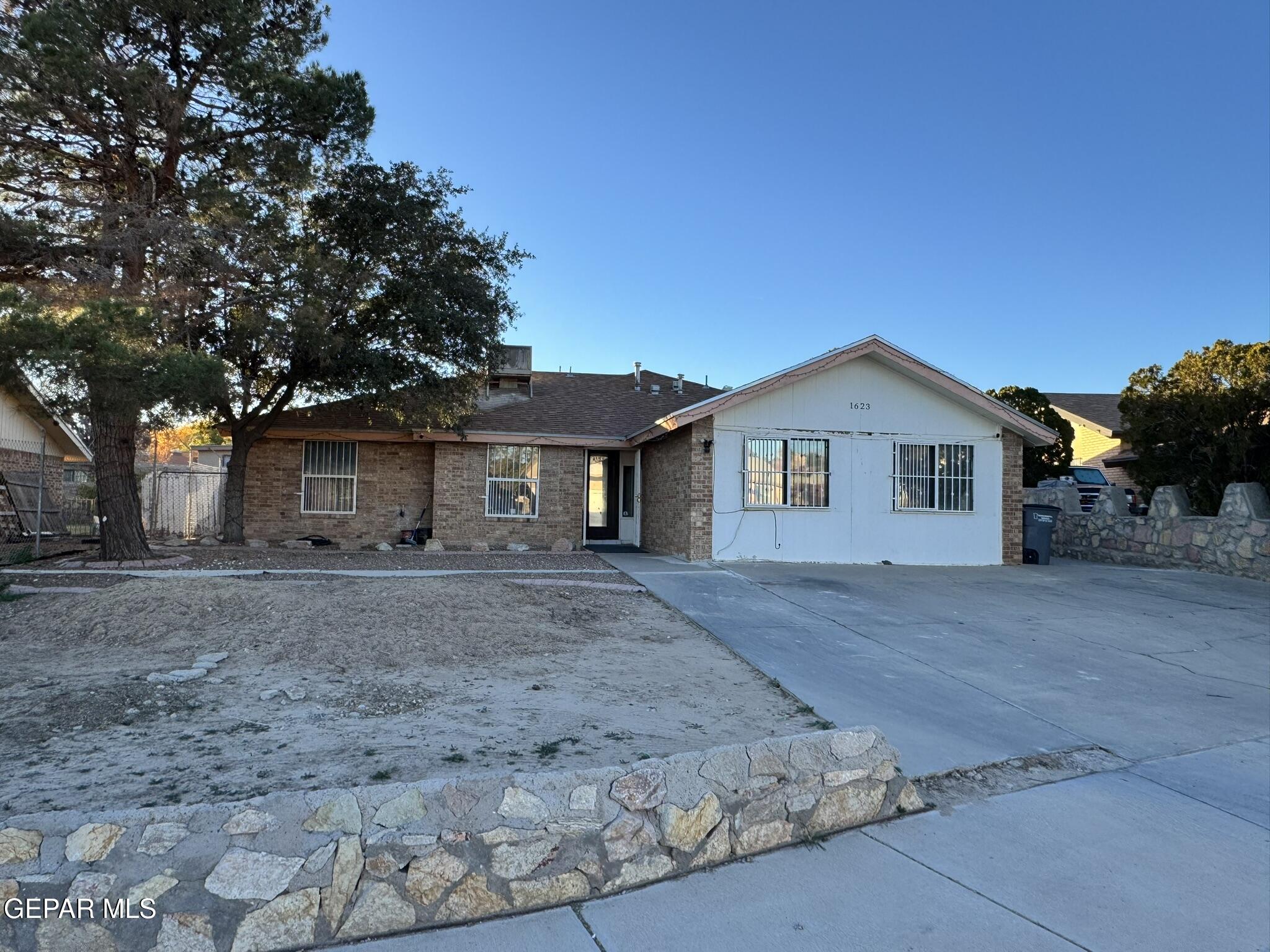 1623 Brian Ray Circle El Paso, TX 79936 - Photo 2 of 37 a front view of a house with a yard and garage
