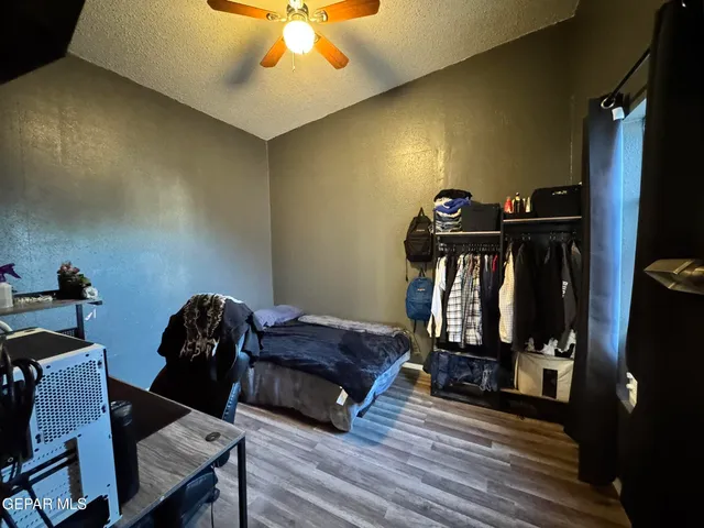 a living room with furniture a air conditioner vent and a window
