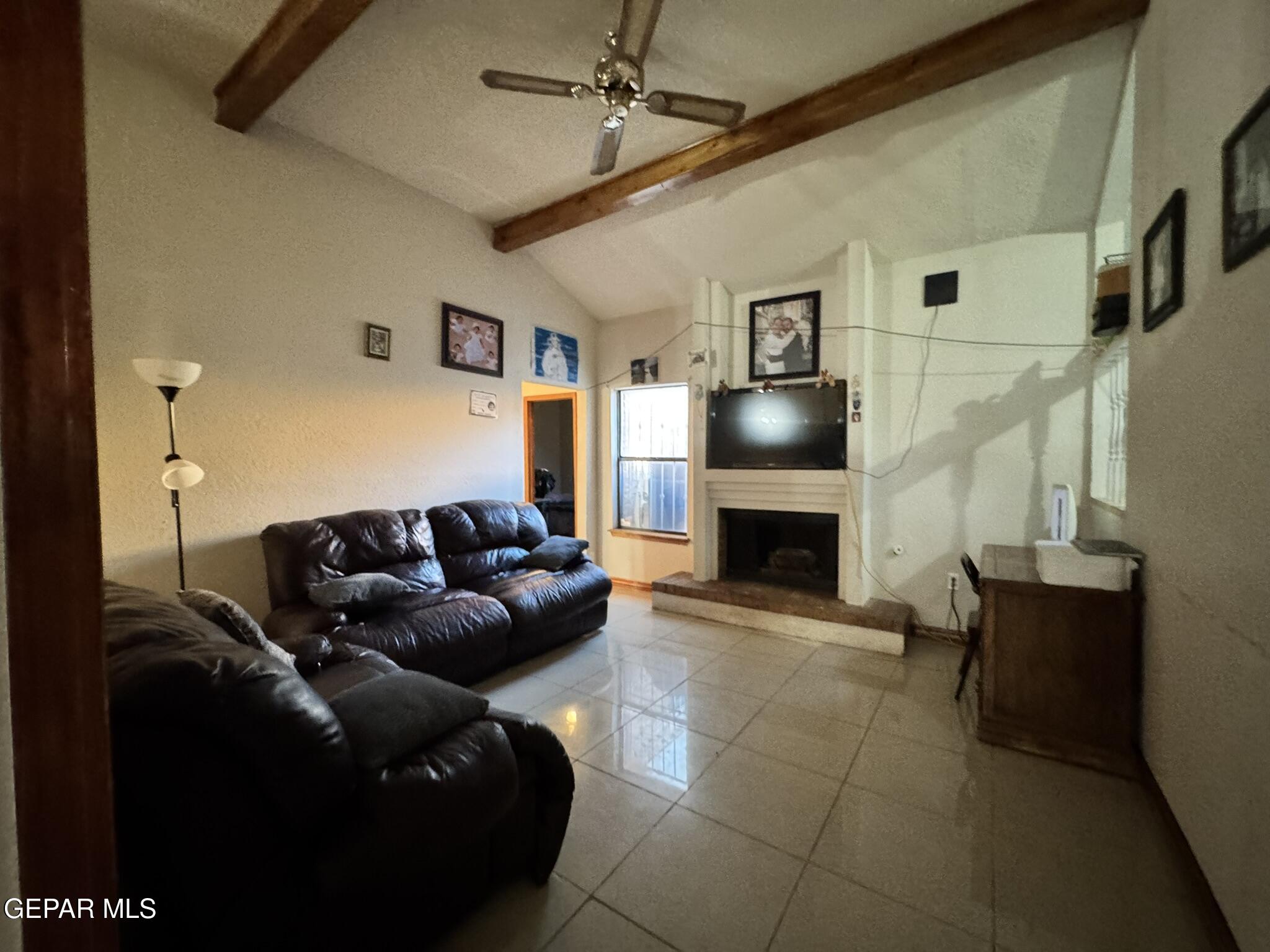 1623 Brian Ray Circle El Paso, TX 79936 - Photo 24 of 37 a living room with furniture and a fireplace