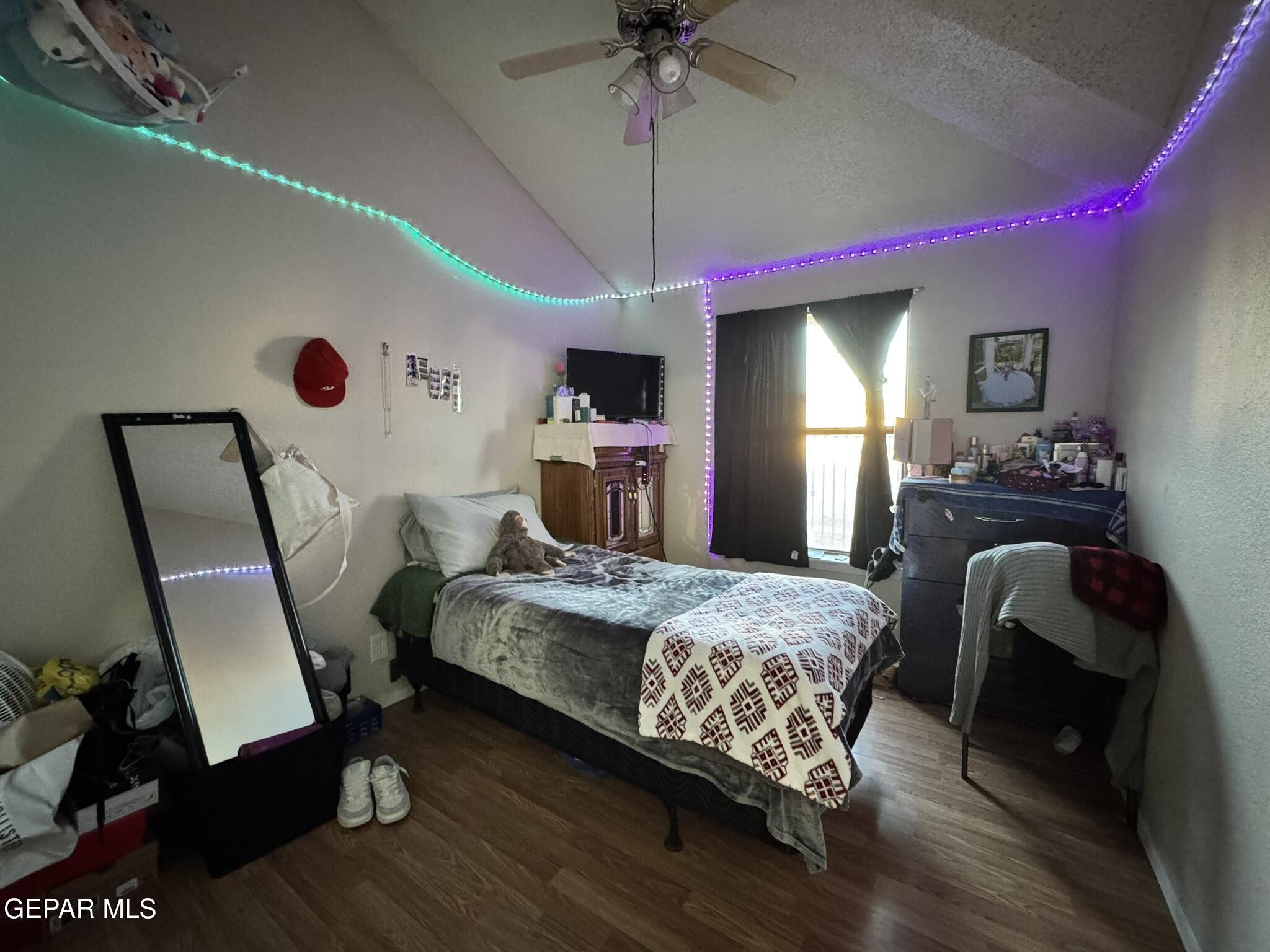 1623 Brian Ray Circle El Paso, TX 79936 - Photo 25 of 37 a bedroom with bed and a chandelier