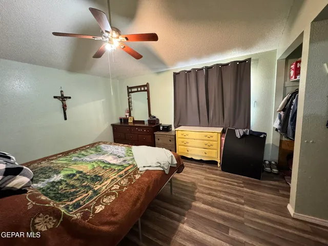 a bedroom with a bed and a walk in closet