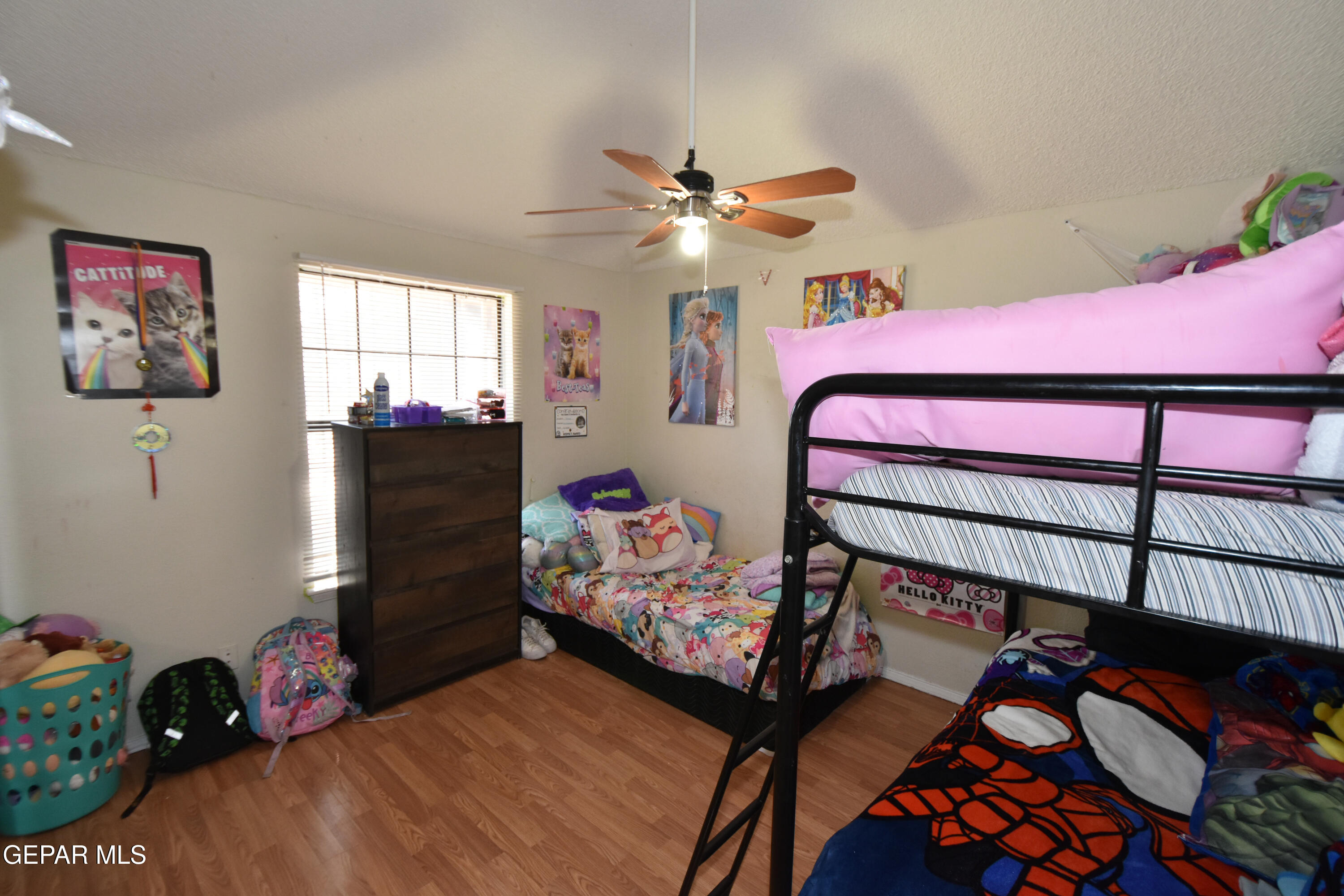 1623 Brian Ray Circle El Paso, TX 79936 - Photo 29 of 41 a bedroom with bed and a chandelier