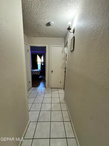 a view of an empty room and fire place