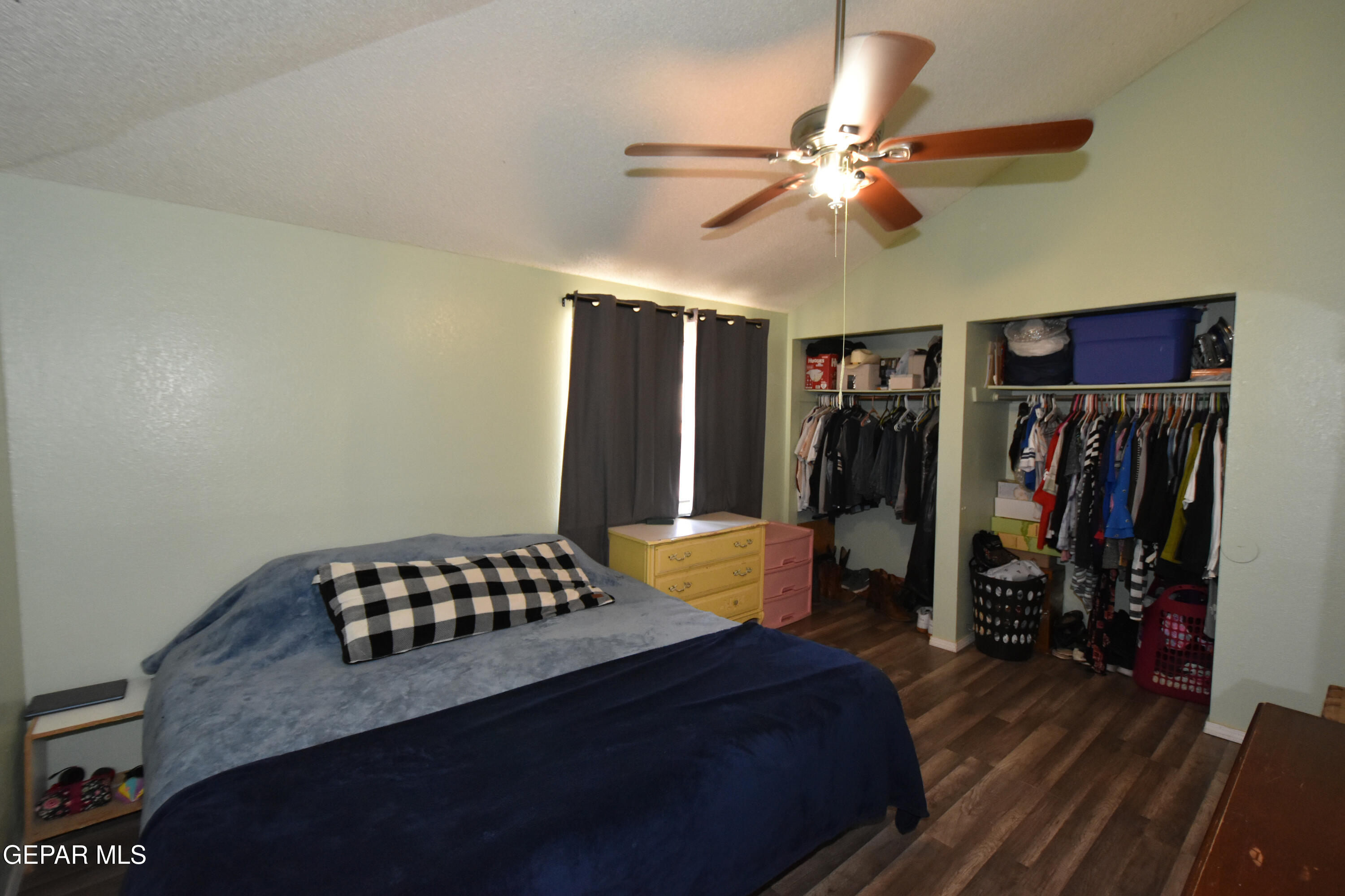 1623 Brian Ray Circle El Paso, TX 79936 - Photo 33 of 41 a bedroom with a bed and a chandelier