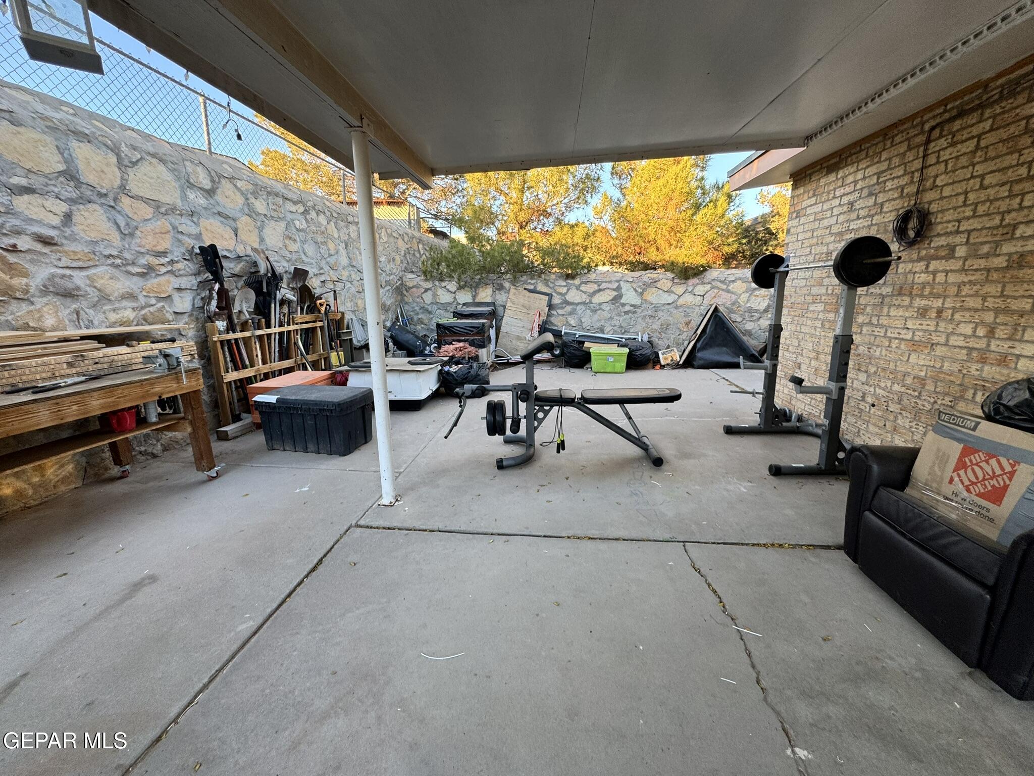 1623 Brian Ray Circle El Paso, TX 79936 - Photo 36 of 37 a living room with patio furniture and a flat screen tv
