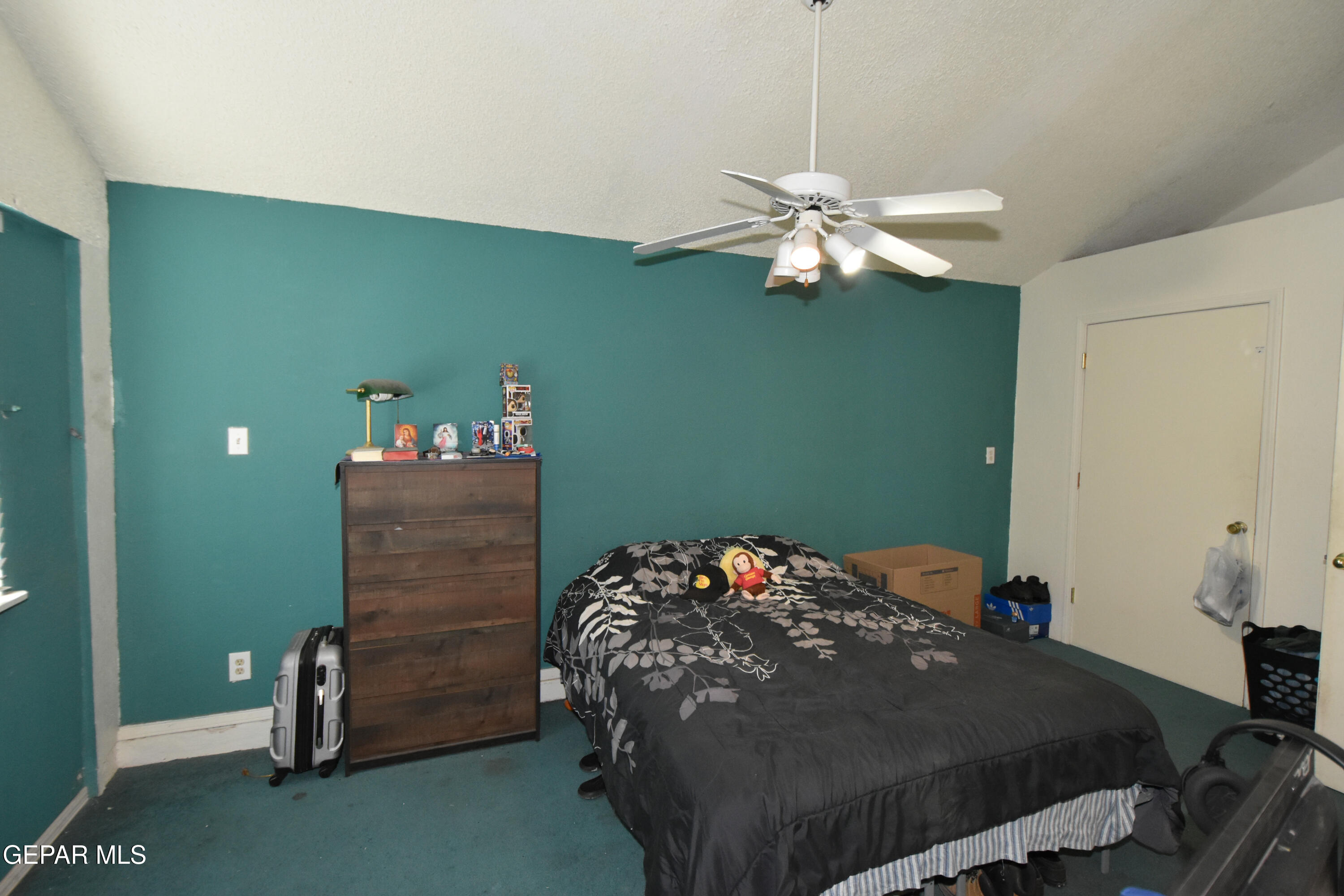 1623 Brian Ray Circle El Paso, TX 79936 - Photo 40 of 41 a bedroom with a bed and a chandelier
