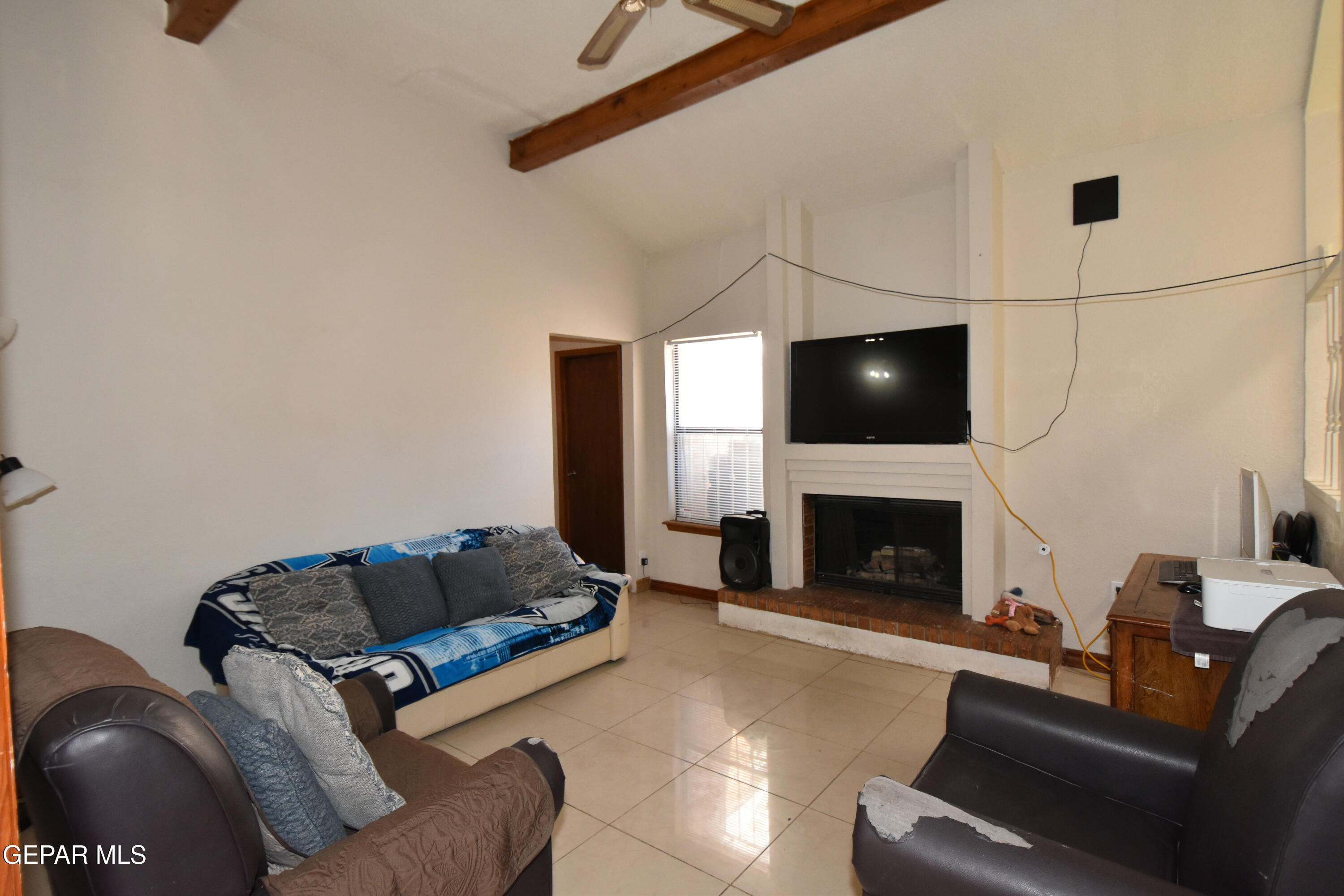 1623 Brian Ray Circle El Paso, TX 79936 - Photo 8 of 41 a living room with furniture and a fireplace