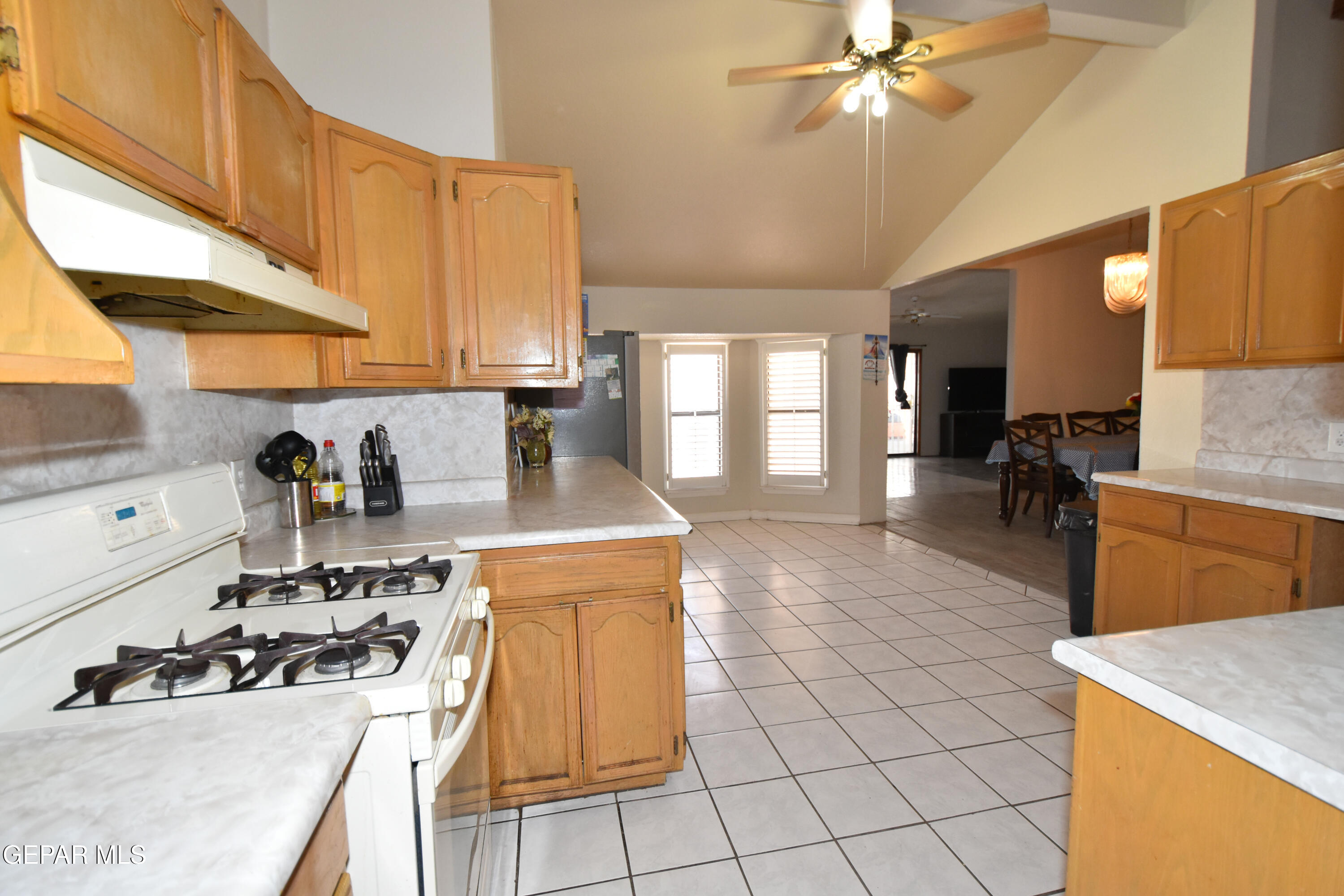 1623 Brian Ray Circle El Paso, TX 79936 - Photo 10 of 41 a kitchen with a sink a stove and white cabinets