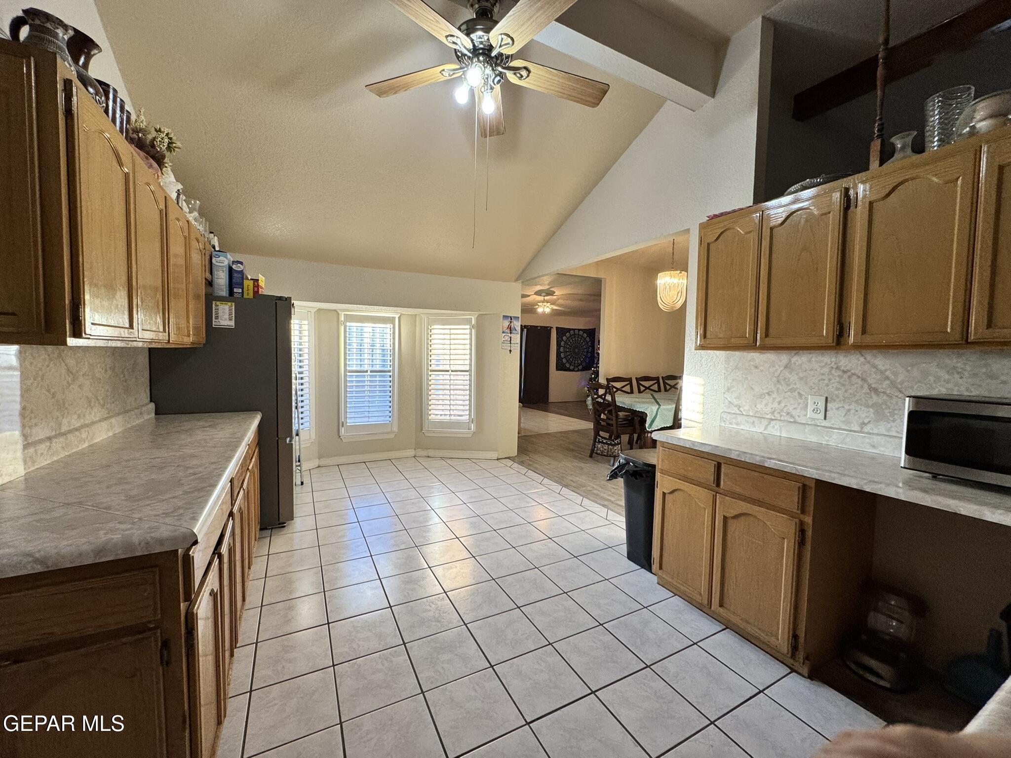 1623 Brian Ray Circle El Paso, TX 79936 - Photo 10 of 37 a kitchen with stainless steel appliances granite countertop a sink and cabinets