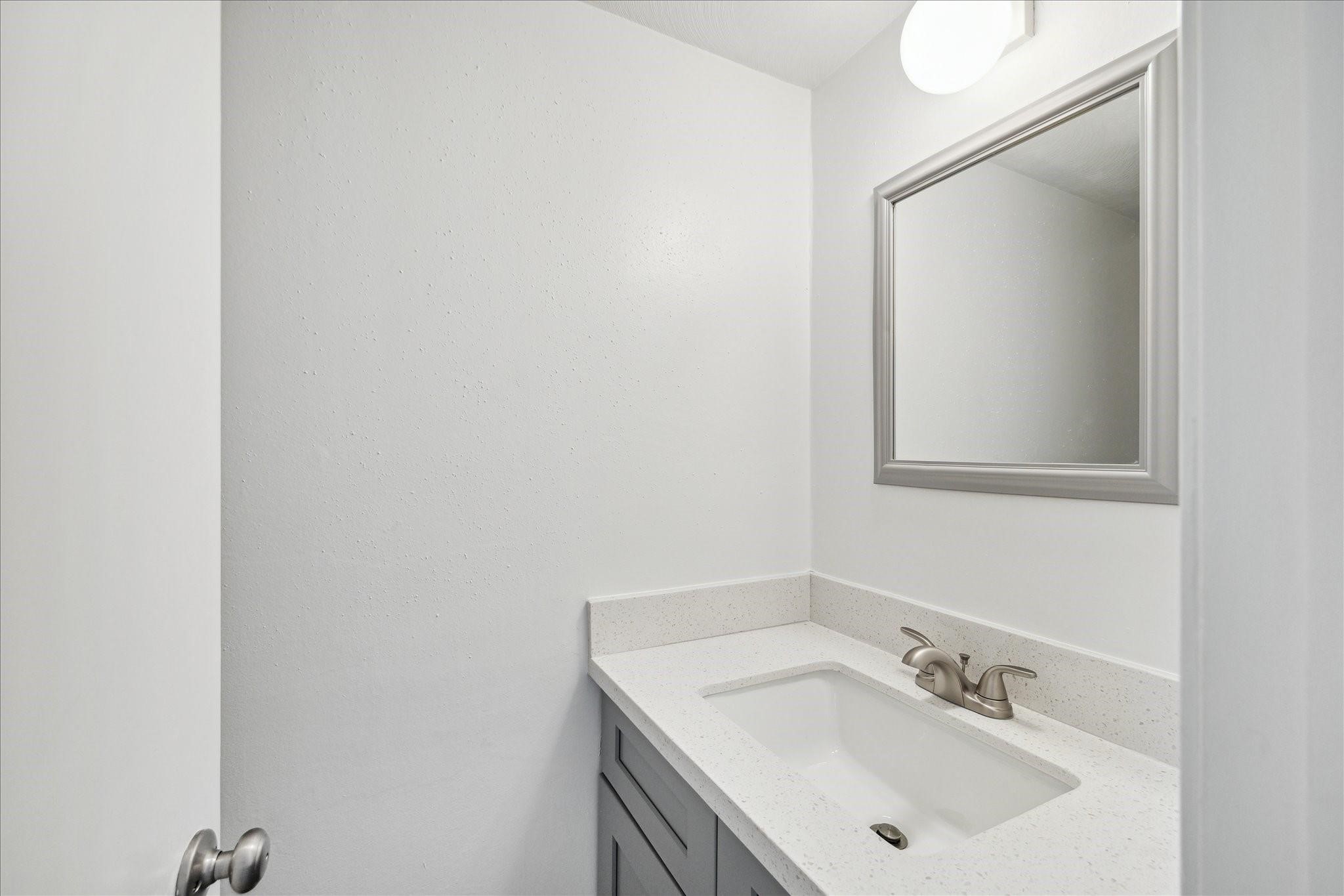 7821 Rue St Cyr Street, Unit 55 Houston, TX 77074 - Photo 5 of 16 Updated powder room with contemporary finishes.