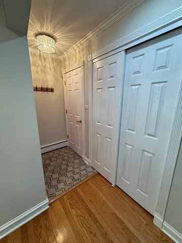 a view of a room with wooden floor and sliding door