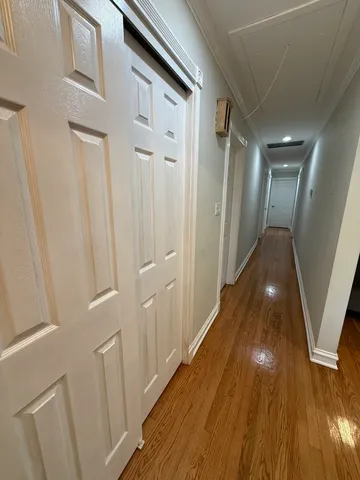 a view of gallery with wooden floor