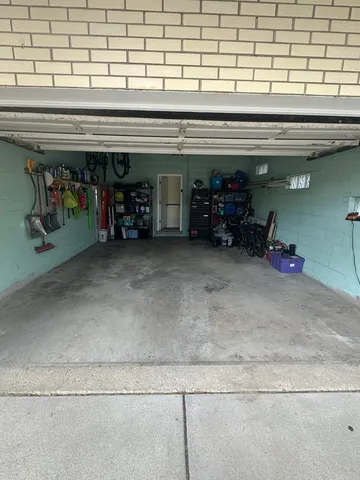 a view of a garage with a white car
