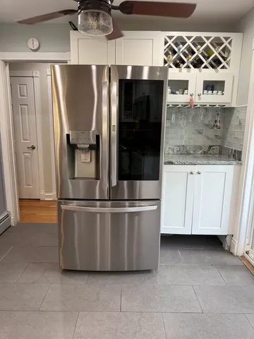 a kitchen with stainless steel appliances wooden cabinets and a counter top space