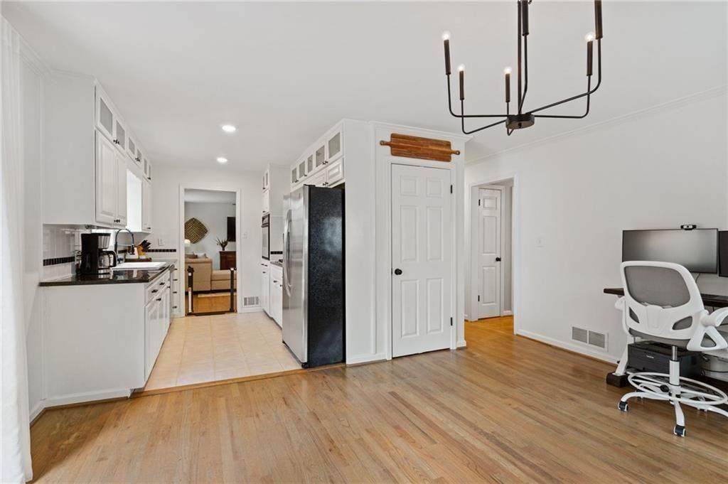 2624 Peeler Road Atlanta, GA 30360 - Photo 17 of 46 a view of a kitchen with wooden floor and electronic appliances