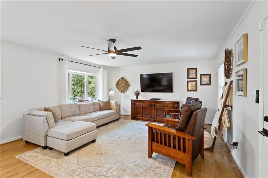 2624 Peeler Road Atlanta, GA 30360 - Photo 2 of 46 a living room with furniture and a flat screen tv