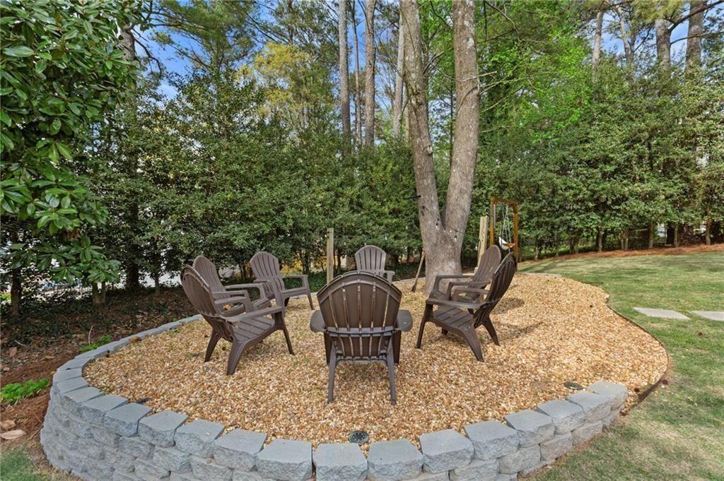 2624 Peeler Road Atlanta, GA 30360 - Photo 37 of 46 a backyard of a house with outdoor seating