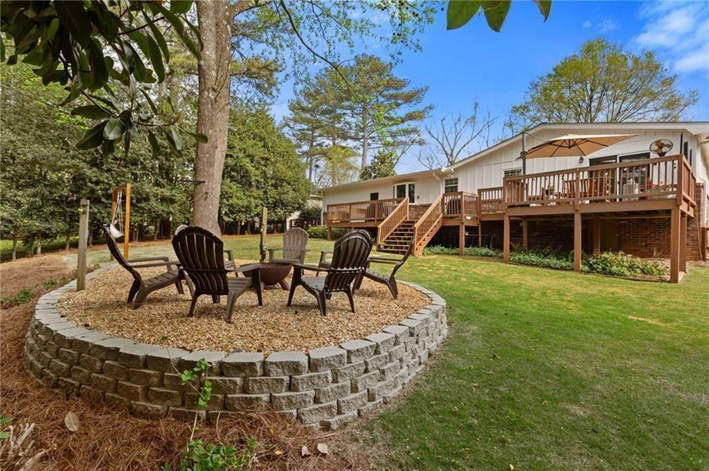 2624 Peeler Road Atlanta, GA 30360 - Photo 38 of 46 a view of a house with backyard porch and sitting area