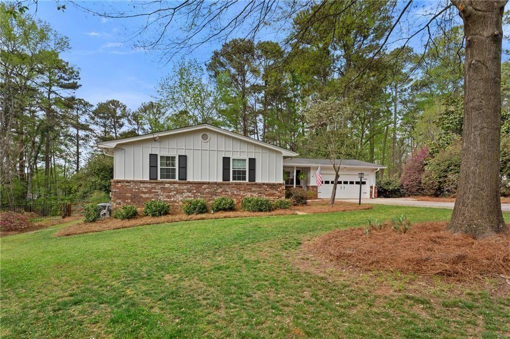 2624 Peeler Road Atlanta, GA 30360 - Photo 43 of 46 a view of a house and a yard with trees
