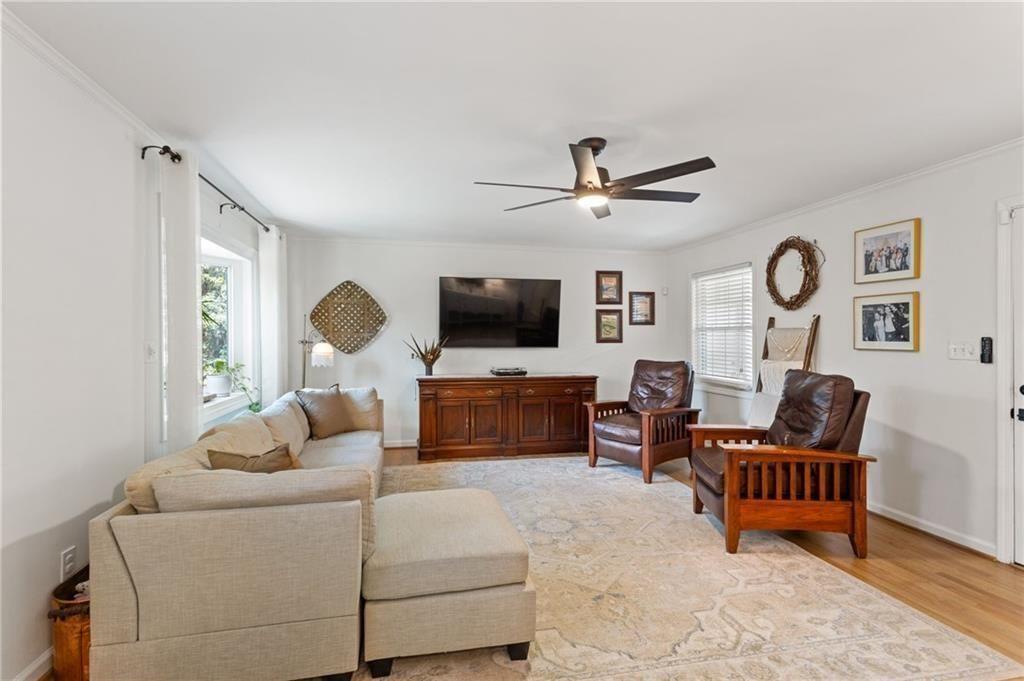 2624 Peeler Road Atlanta, GA 30360 - Photo 8 of 46 a living room with furniture and a flat screen tv