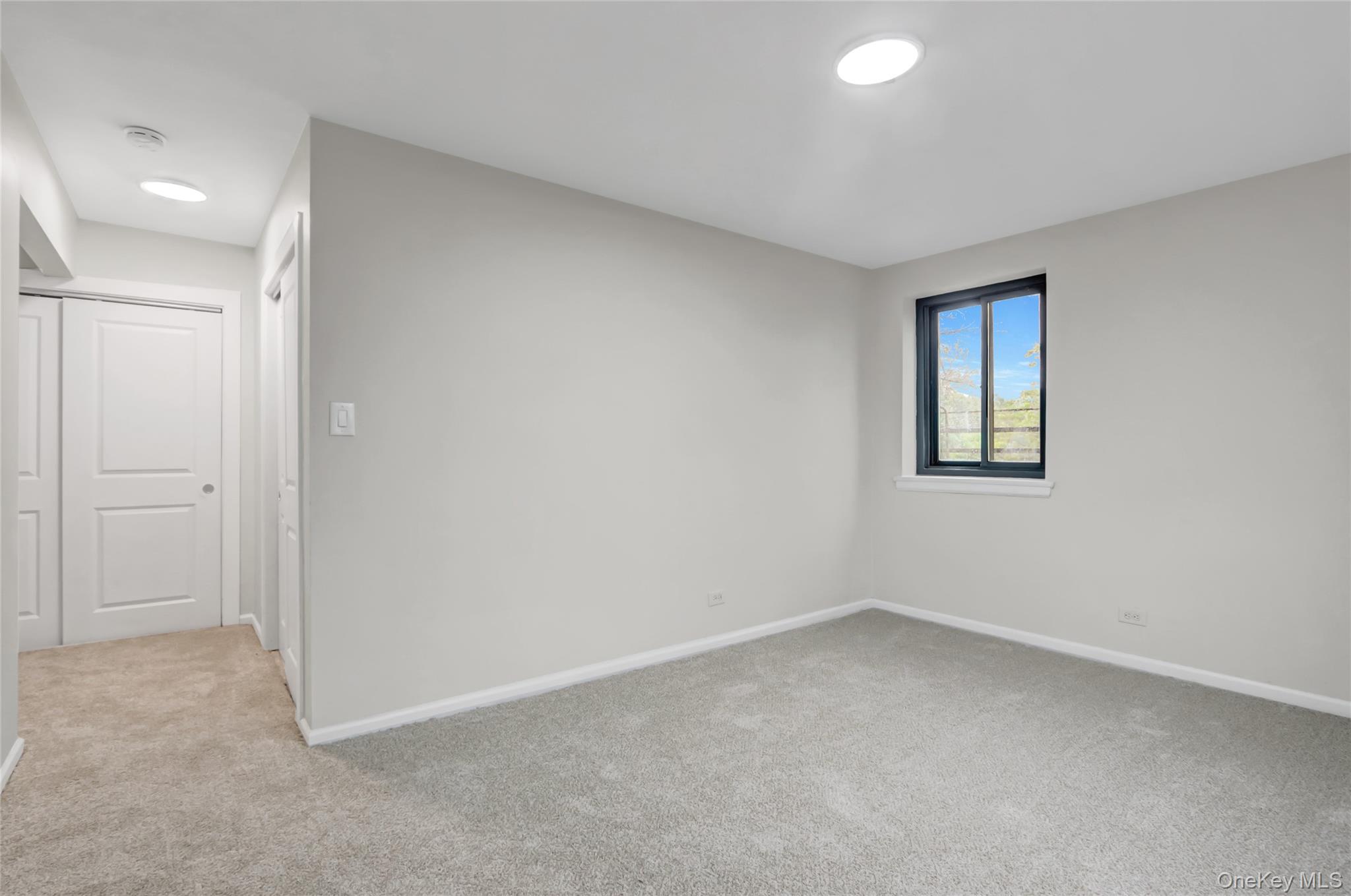 204-15 Foothill Avenue, Unit B53 Queens, NY 11427 - Photo 6 of 18 an empty room with a window