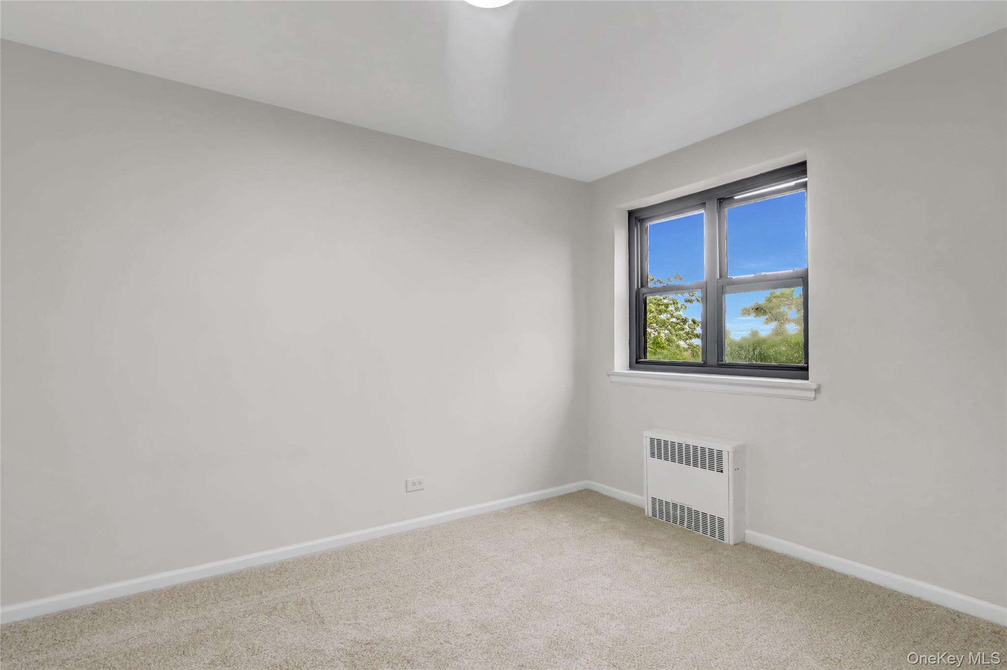 204-15 Foothill Avenue, Unit B53 Queens, NY 11427 - Photo 7 of 18 a view of an empty room and window