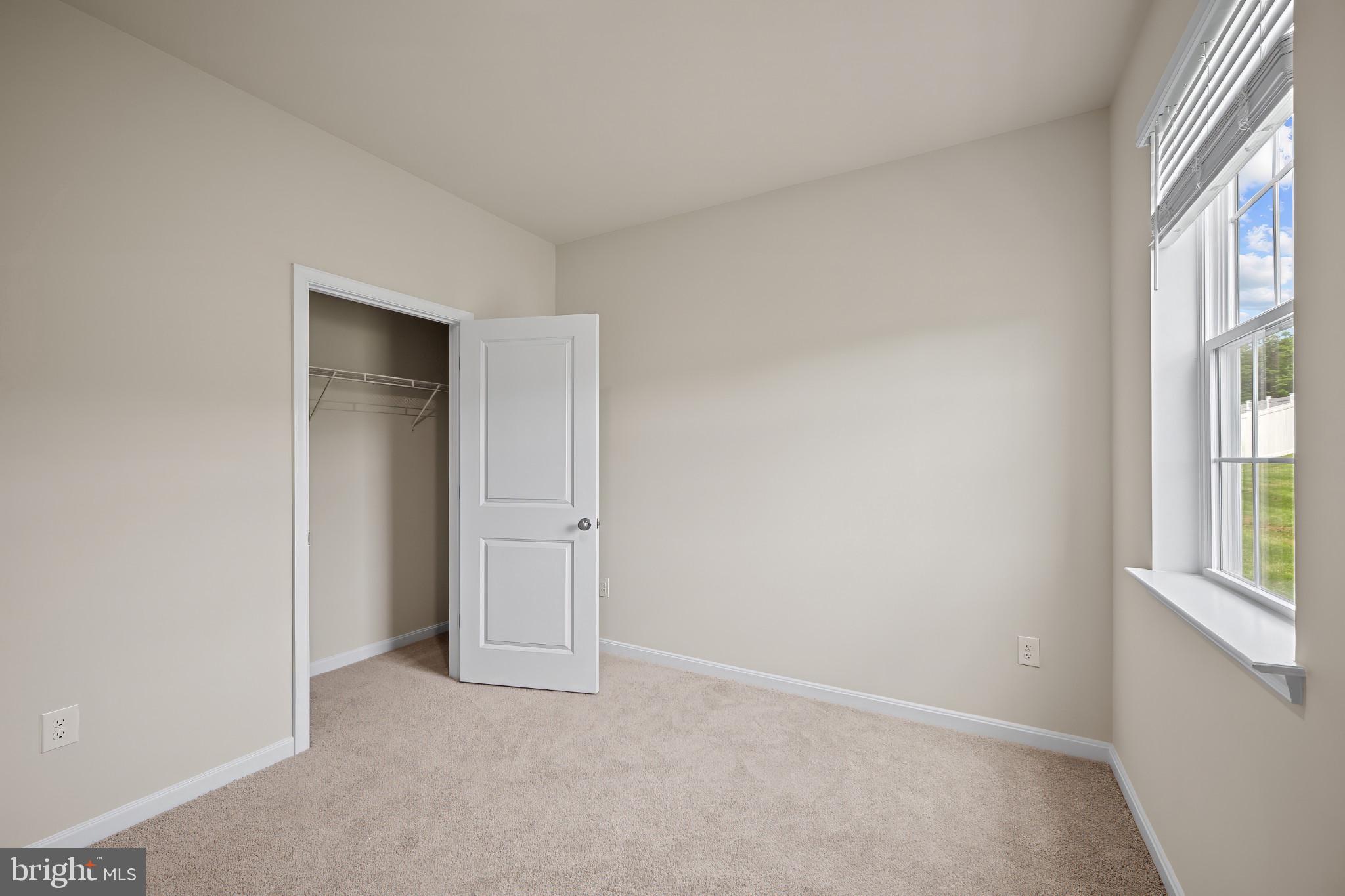 547 Atkinson Street Charles Town, WV 25414 - Photo 12 of 31 an empty room with windows and closet
