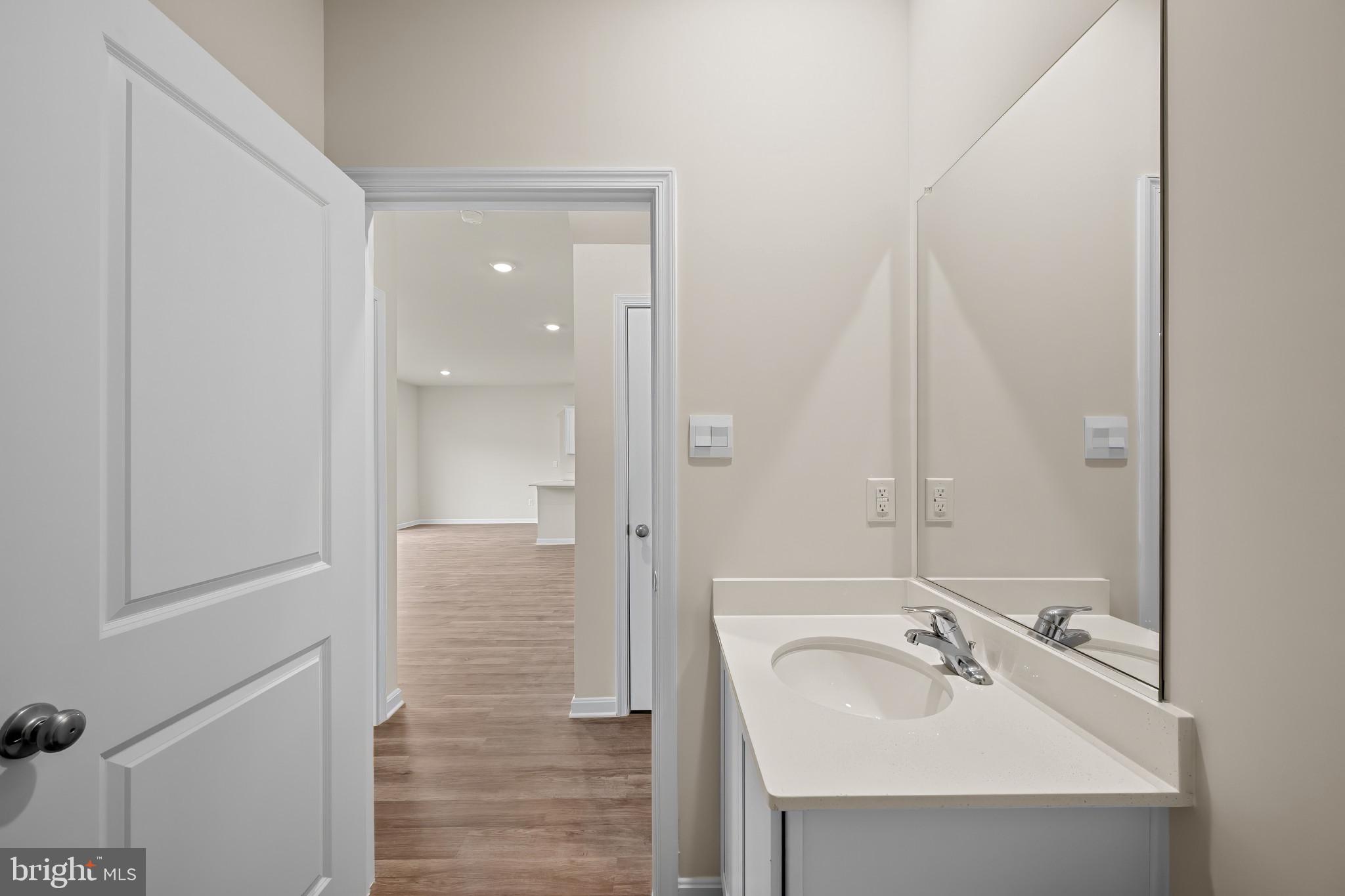 547 Atkinson Street Charles Town, WV 25414 - Photo 13 of 31 a bathroom with a sink a mirror and shower