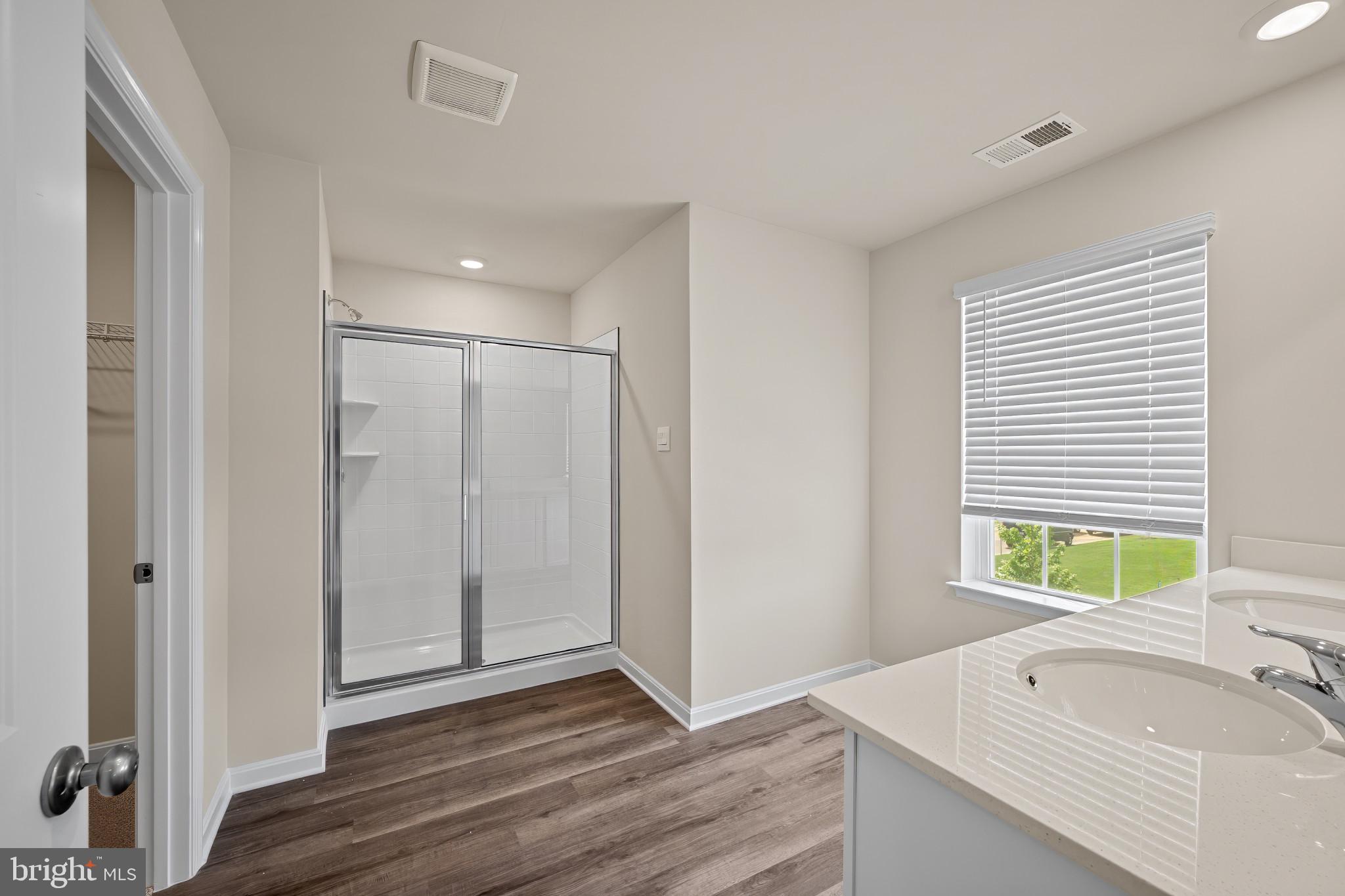 547 Atkinson Street Charles Town, WV 25414 - Photo 18 of 31 a bathroom with a tub sink and a window