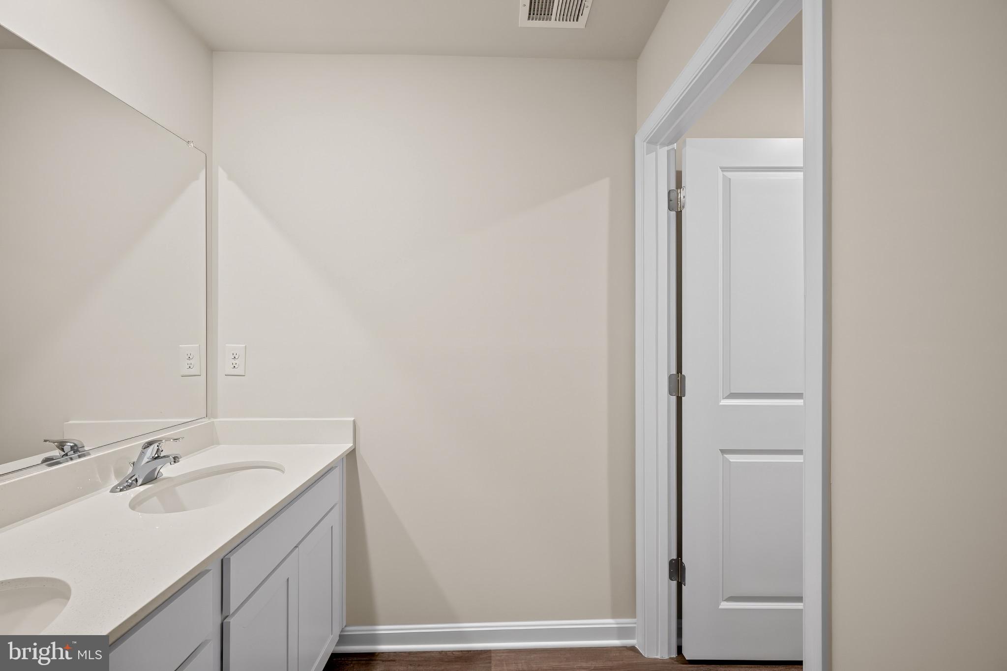 547 Atkinson Street Charles Town, WV 25414 - Photo 26 of 31 a bathroom with a sink and a mirror