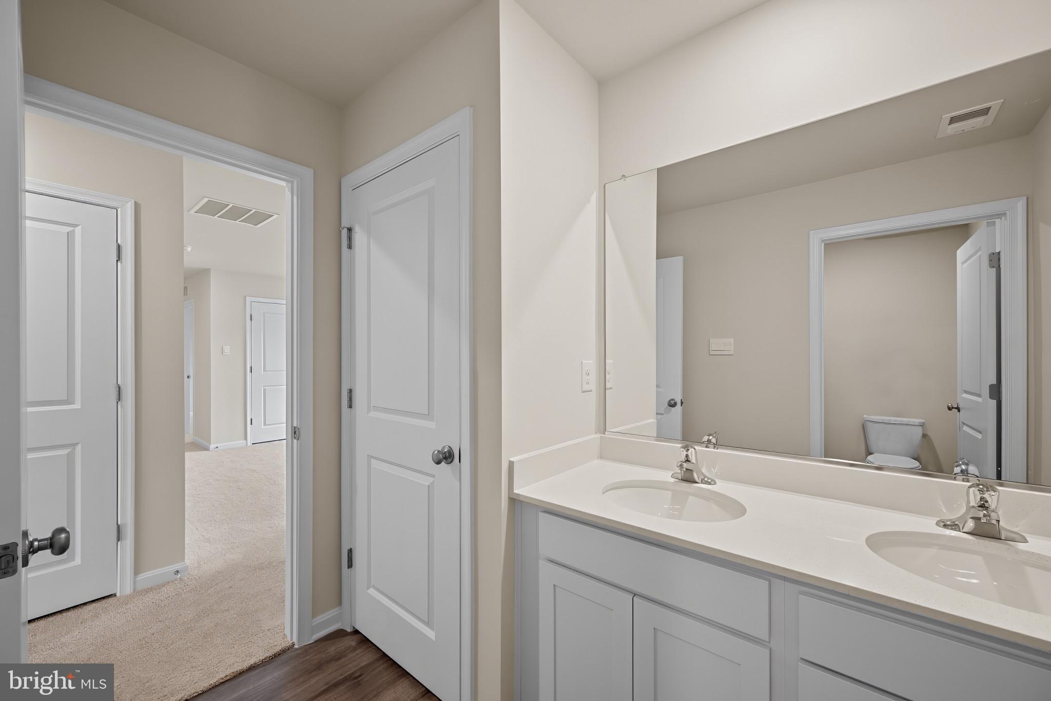 547 Atkinson Street Charles Town, WV 25414 - Photo 27 of 31 a bathroom with 2 sink and a mirror