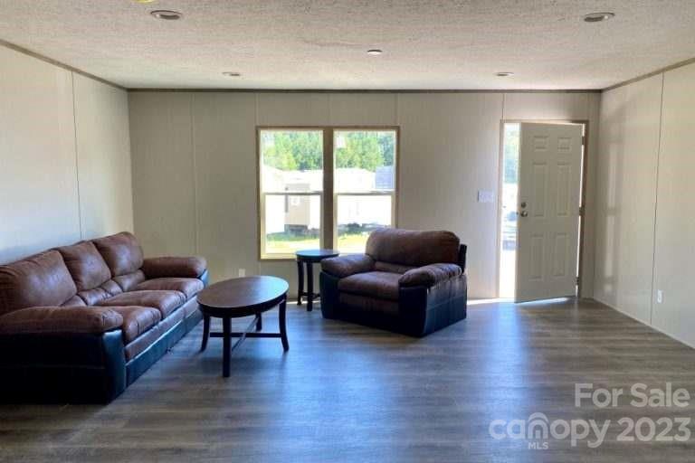 2550 Saluda Road Chester, SC 29706 - Photo 3 of 6 a living room with furniture and a wooden floor