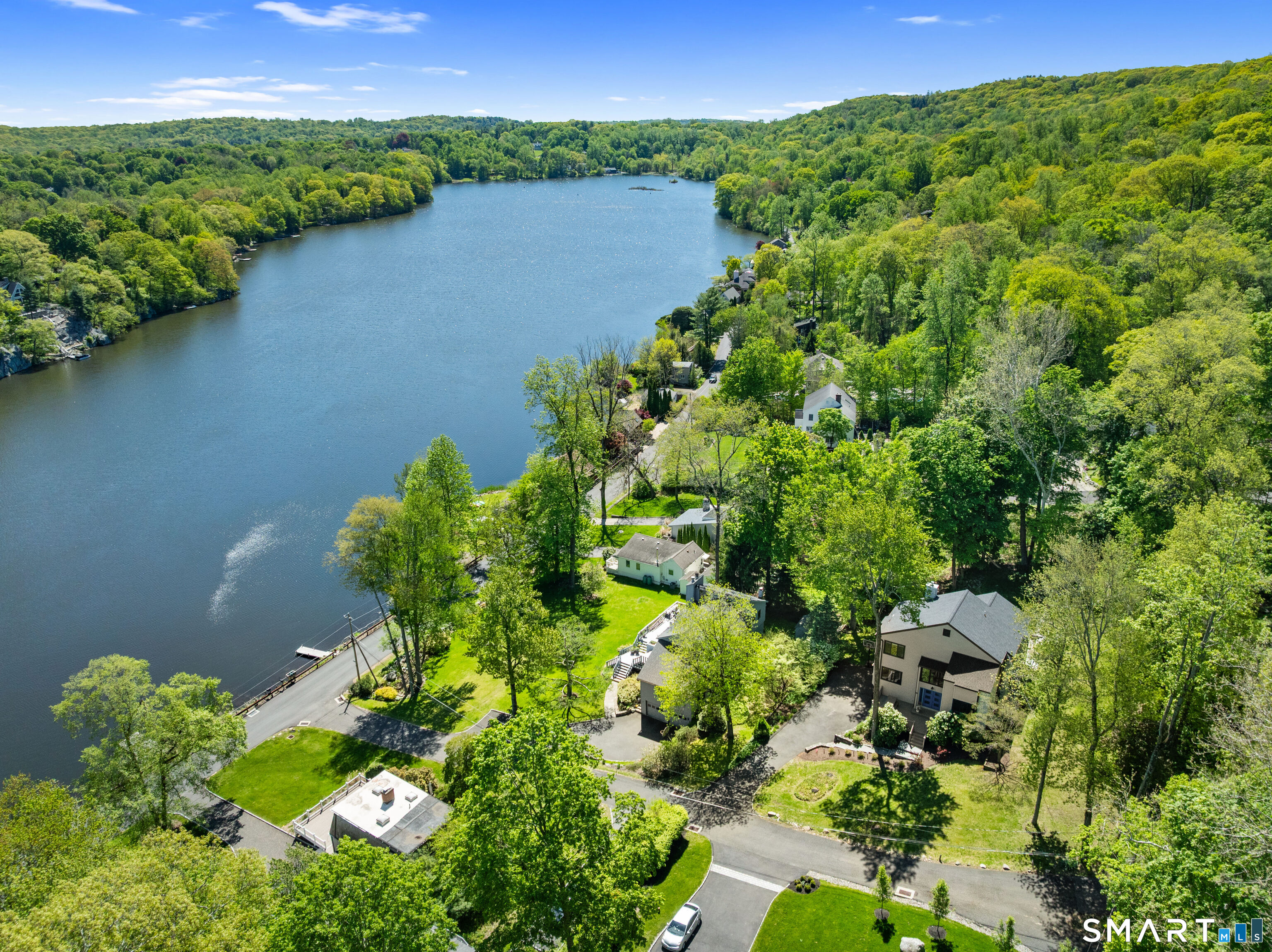 9 1st Lane Ridgefield, CT 06877 - Photo 2 of 40 Year-round retreat with water views & walk to lake.