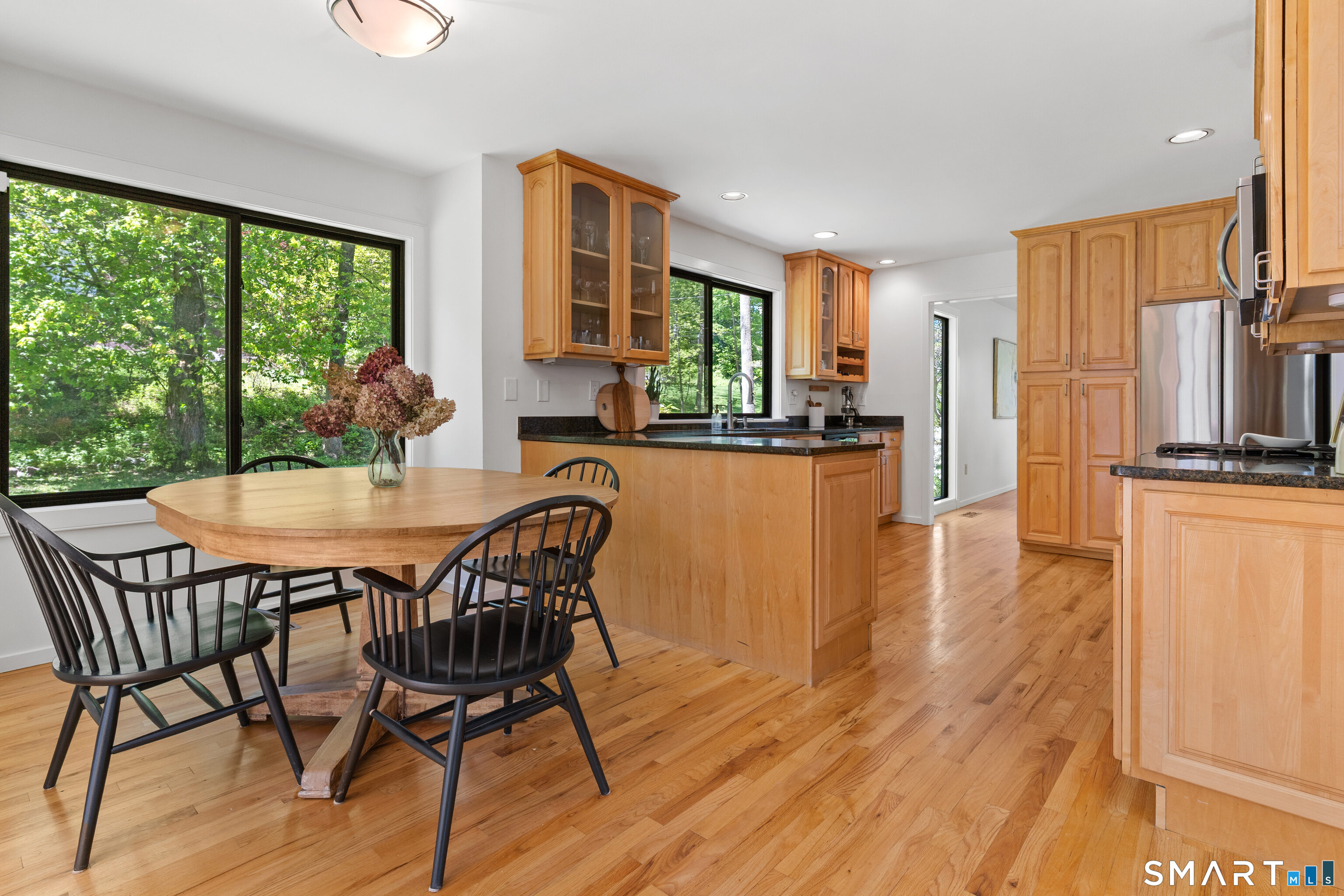 9 1st Lane Ridgefield, CT 06877 - Photo 23 of 40 Eat-in dining area with butler's pantry, wet bar, laundry, & glass slider opening to back deck.