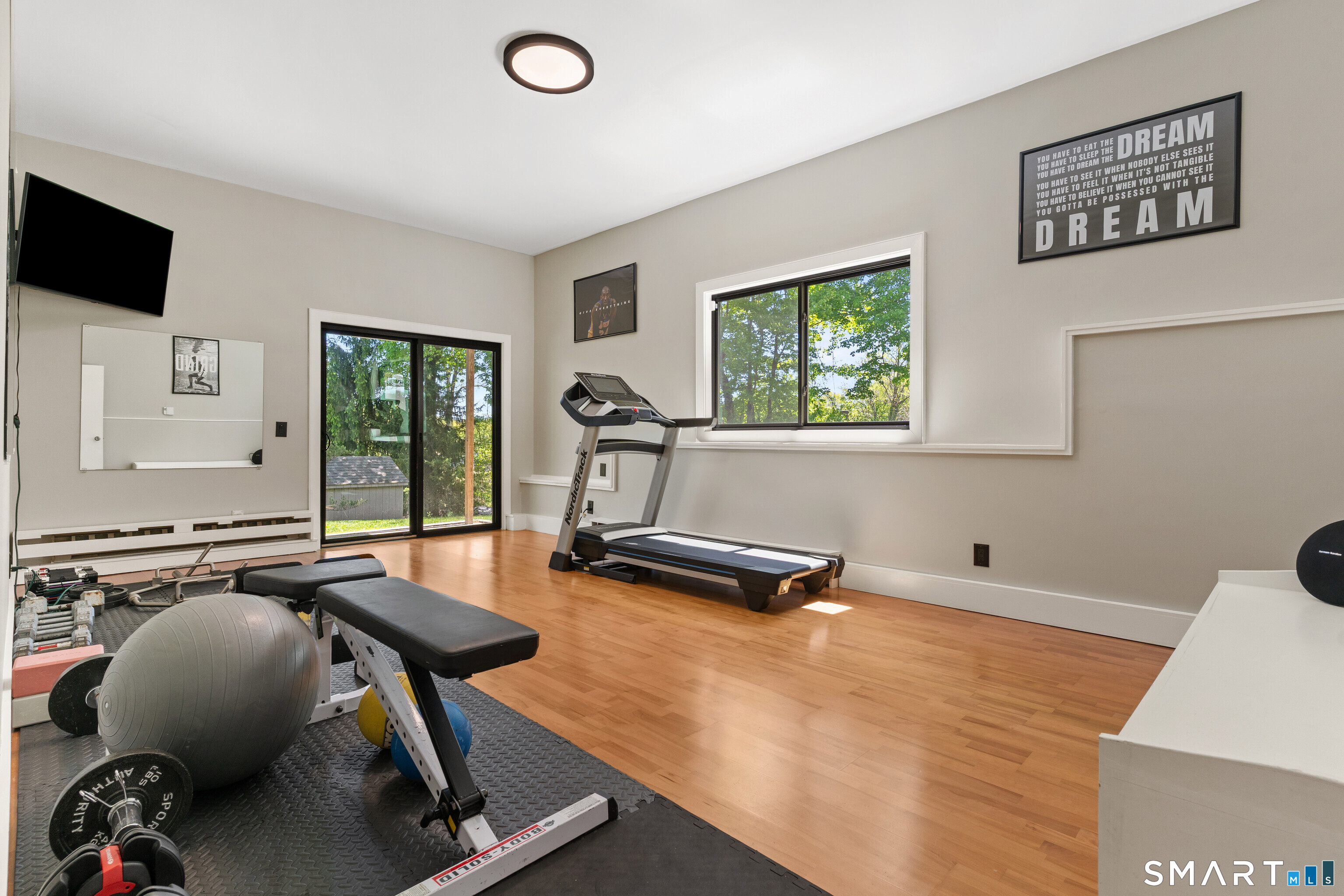 9 1st Lane Ridgefield, CT 06877 - Photo 35 of 40 Partially finished walkout lower level well-suited for home gym, office, rec room, or play room.
