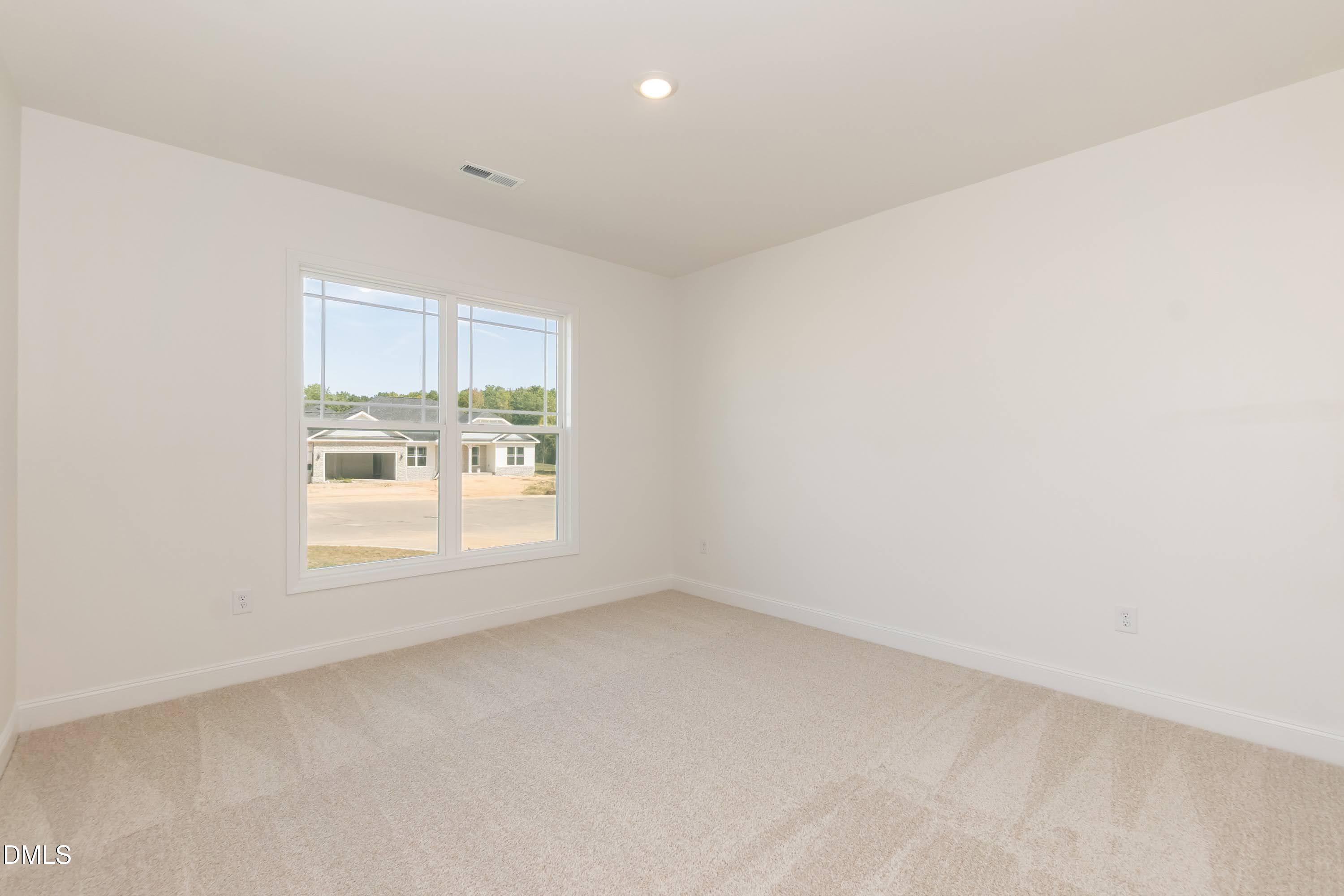 254 Galway Road Lillington, NC 27546 - Photo 27 of 35 an empty room with a window