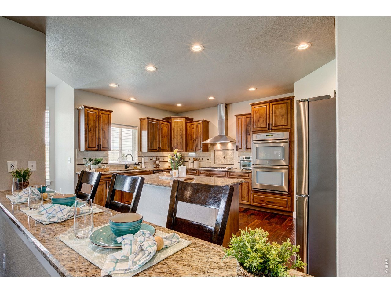 39764 Ridge Park Drive Severance, CO 80610 - Photo 17 of 49 Stunning Chef's Kitchen with eating or serving bar.