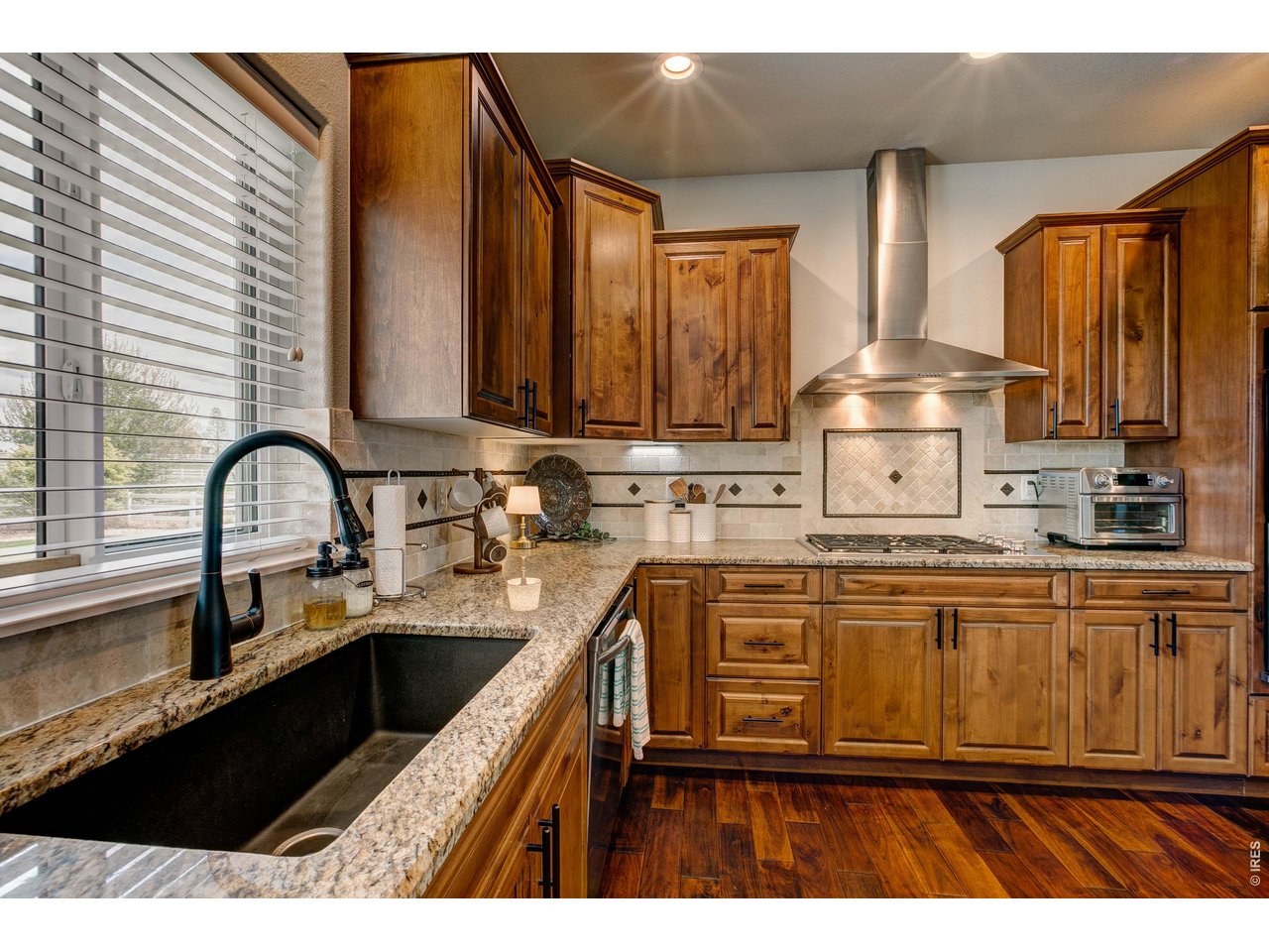 39764 Ridge Park Drive Severance, CO 80610 - Photo 19 of 49 Large granite composite sink and genuine granite counters! Full backsplash and CityScape cabinets.