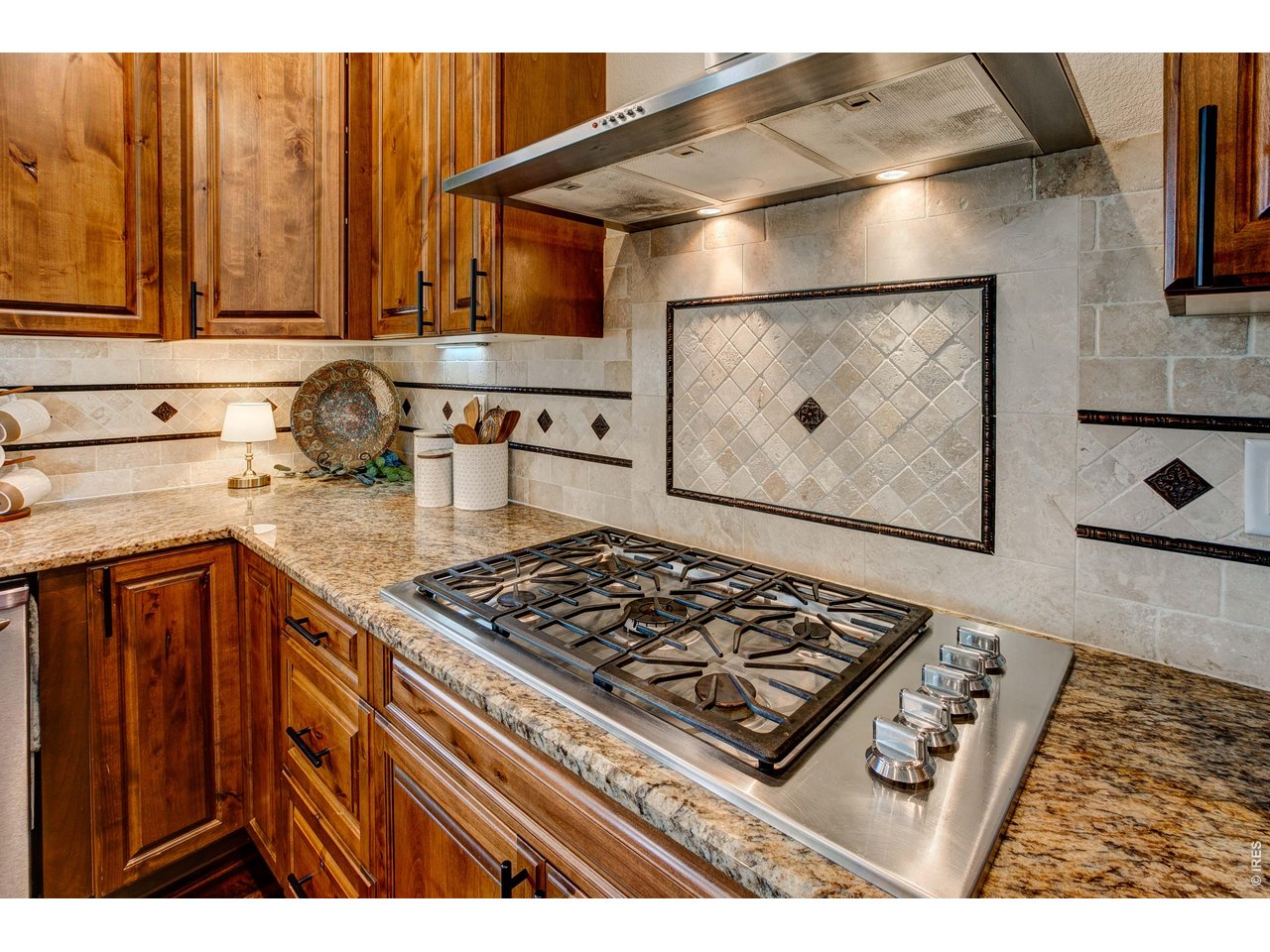 39764 Ridge Park Drive Severance, CO 80610 - Photo 20 of 49 Gas Range top and Vent hood