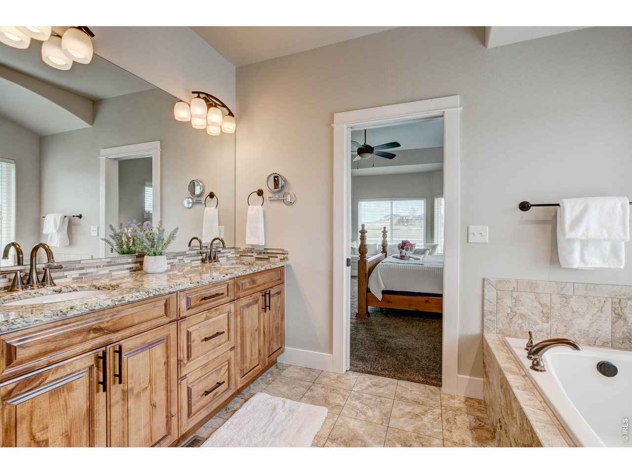 39764 Ridge Park Drive Severance, CO 80610 - Photo 26 of 49 Dual Sinks and Granite Countertops with loads of storage in your Primary Bath.