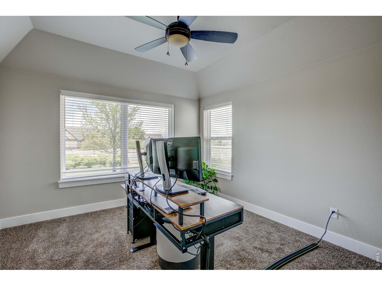 39764 Ridge Park Drive Severance, CO 80610 - Photo 28 of 49 Main Level Front Bedroom with French doors doubling as an Office area. Check out the ceiling detail!