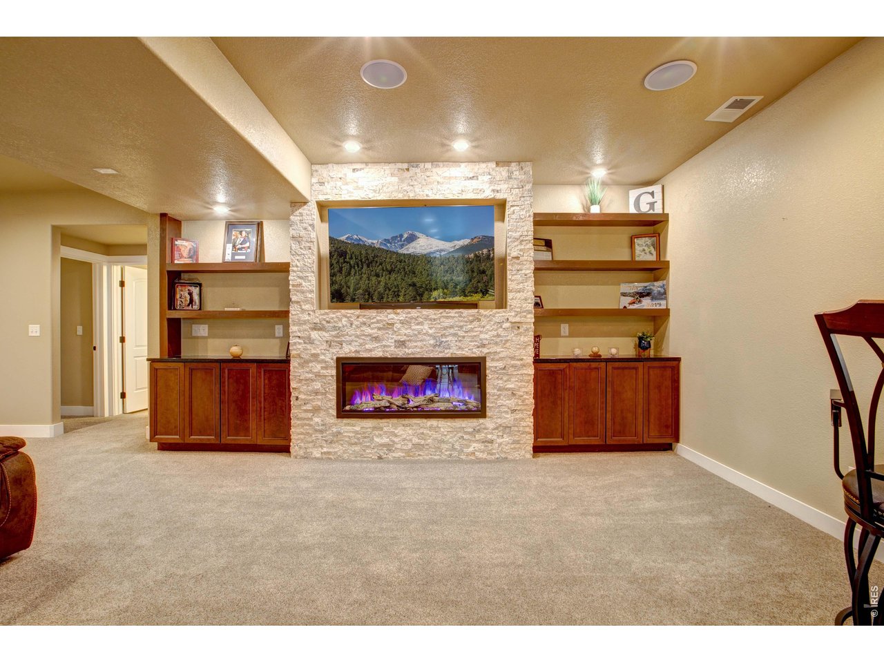 39764 Ridge Park Drive Severance, CO 80610 - Photo 35 of 49 Stunning Electric Fireplace and Custom Built-in Cabinets