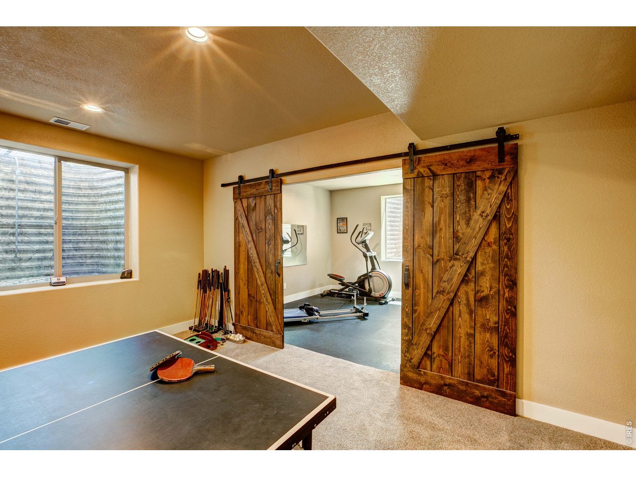 39764 Ridge Park Drive Severance, CO 80610 - Photo 40 of 49 Check out those Barn Doors! They provide privacy to your own Home Gym!