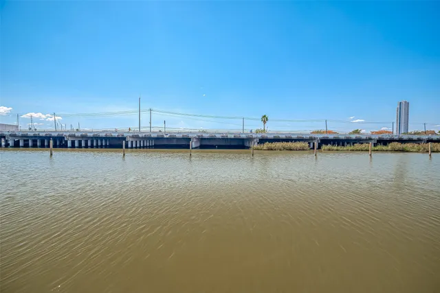 a view of a city with tall buildings and a big yard