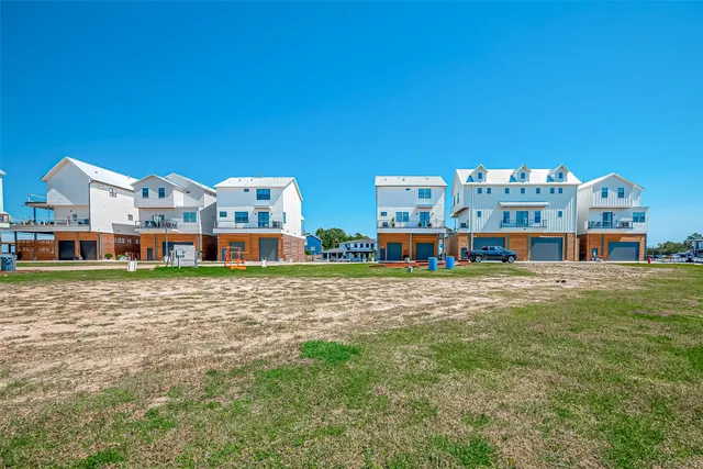 a view of city with tall buildings and a park
